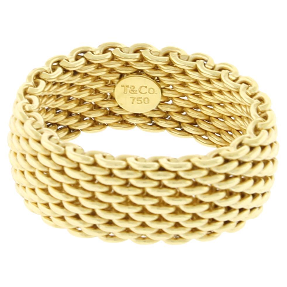 From Tiffany, the Somerset collection offers an 18 karat gold somerset mesh band ring.
• Designer Tiffany & Co.
• Metal: 18 karat gold
• Weight: 14.4 grams
• Width: 10mm
• Circa: 21st Century
• Size: 10 cannot be resized
• Packaging:  Tiffany