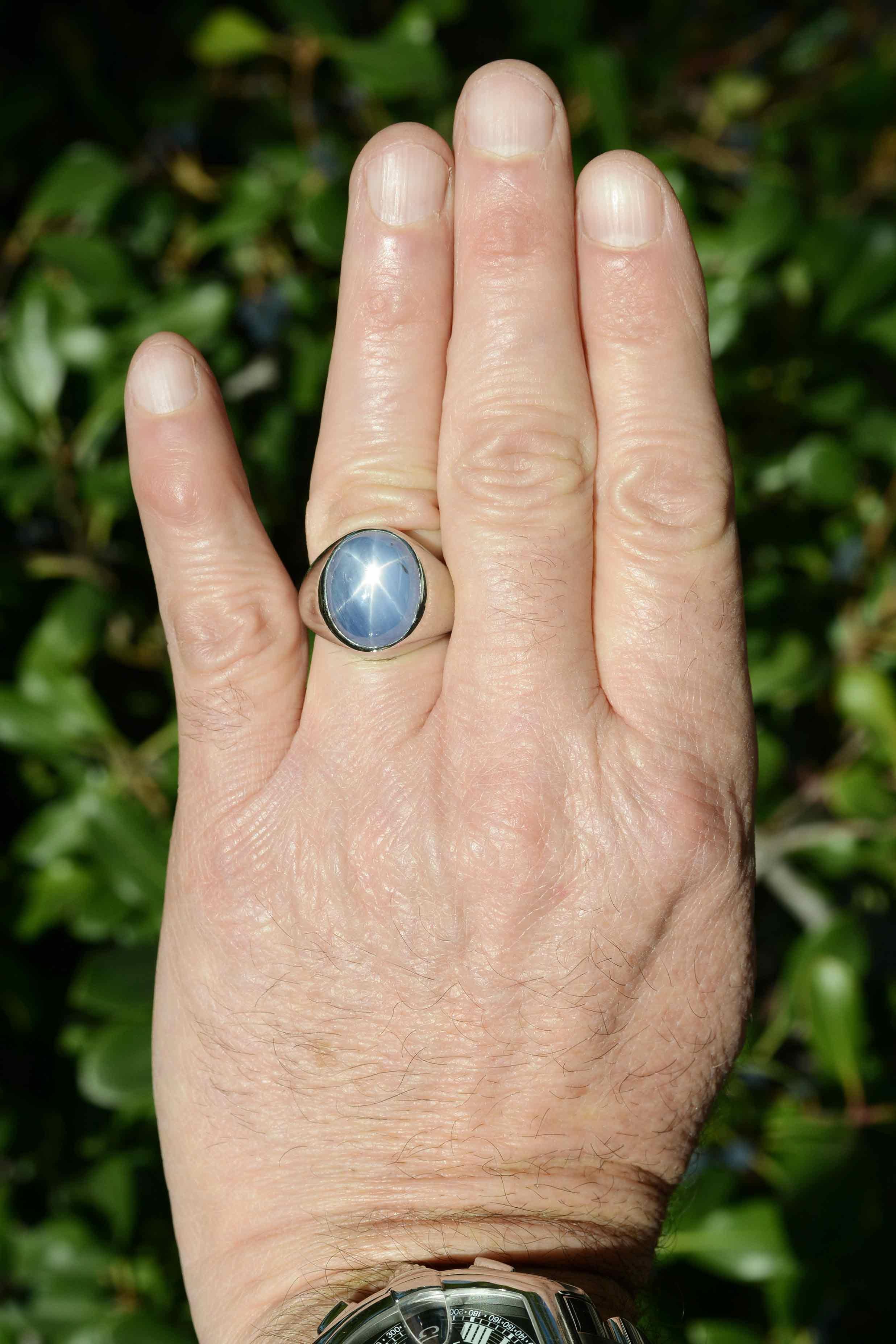 An Important, monumental Tiffany star sapphire mens ring. Centered by a dome cabochon weighing a considerable 26 carats. Set in a heavy platinum mount, the smooth, Mid Century style slips on your finger effortlessly and projects an impeccable style.