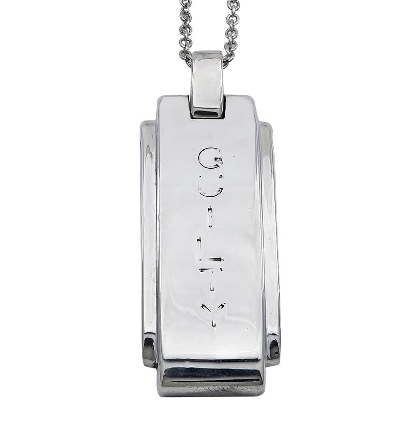 An amusing piece of jewelry:  a sterling silver pendant engraved 