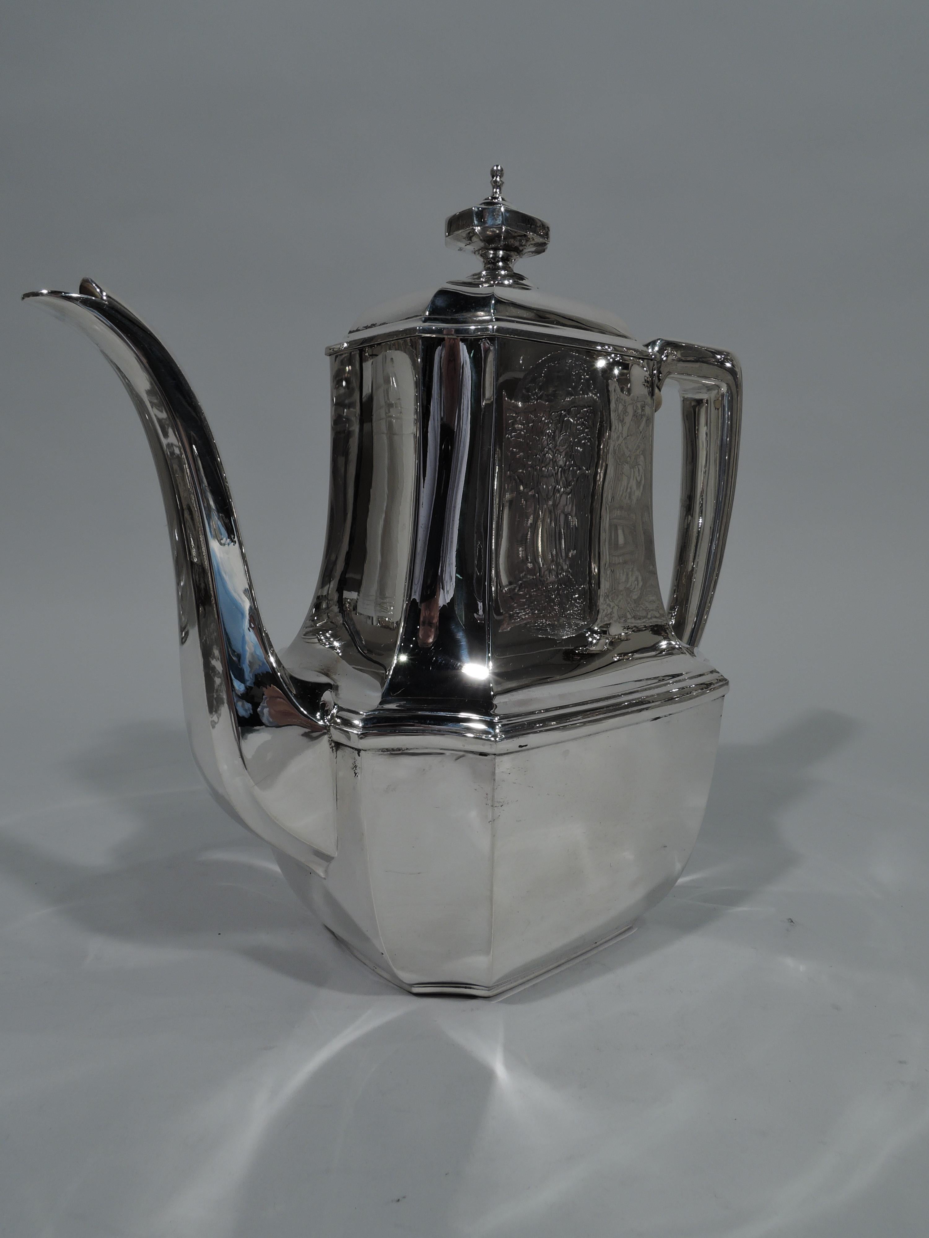 Art Deco sterling silver coffeepot in desirable Hampton. Made by Tiffany & Co. in New York. Rectilinear body with concave corners, faceted s-spout, scroll-bracket handle, and hinged and domed cover with finial. A great piece in the enduringly
