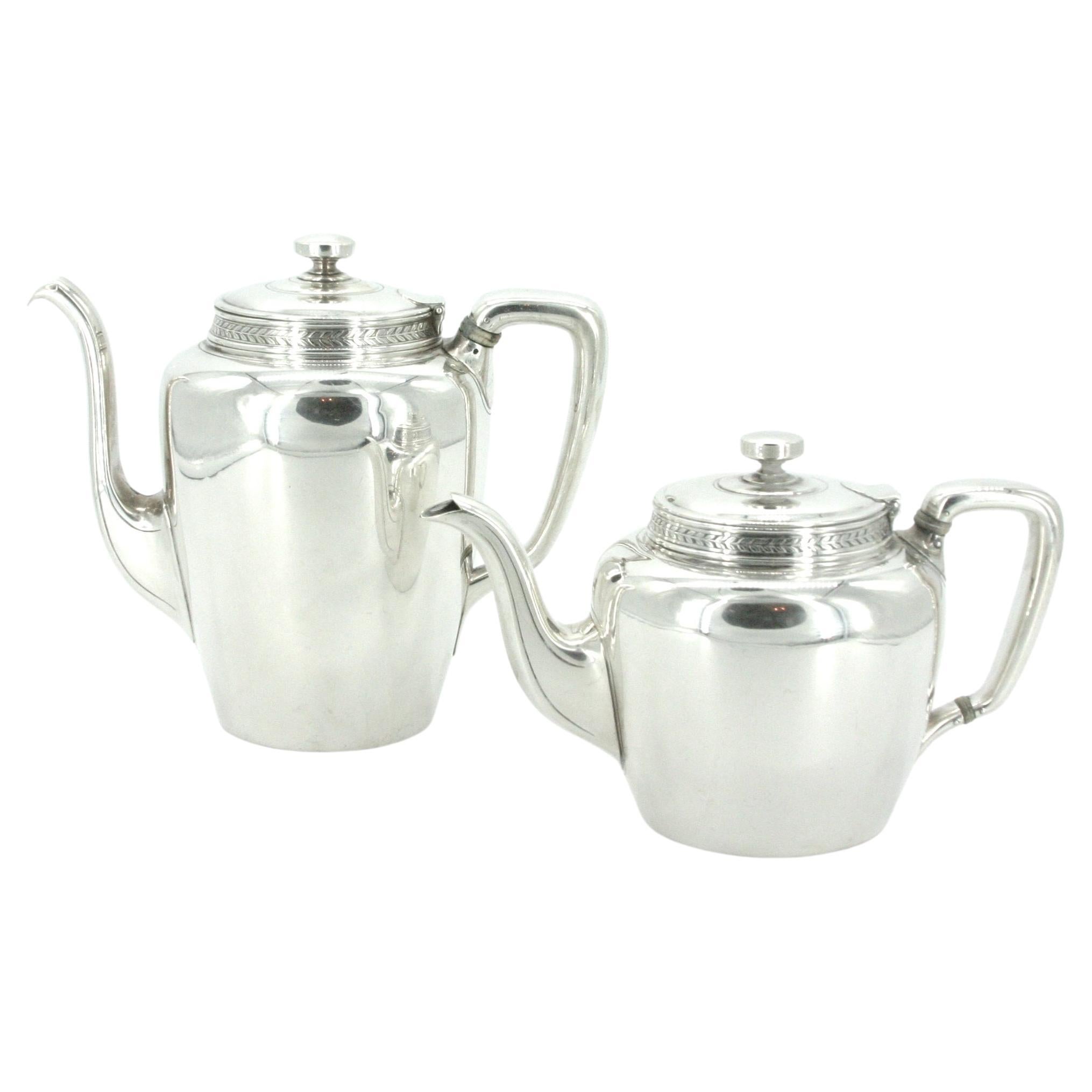 Tiffany sterling silver coffee and tea service. This set comprises 5 pieces: Coffee pot, teapot, creamer, sugar, and waste bowl. Each piece is great condition . Minor wear consistent with age / use . Maker's mark undersigned 