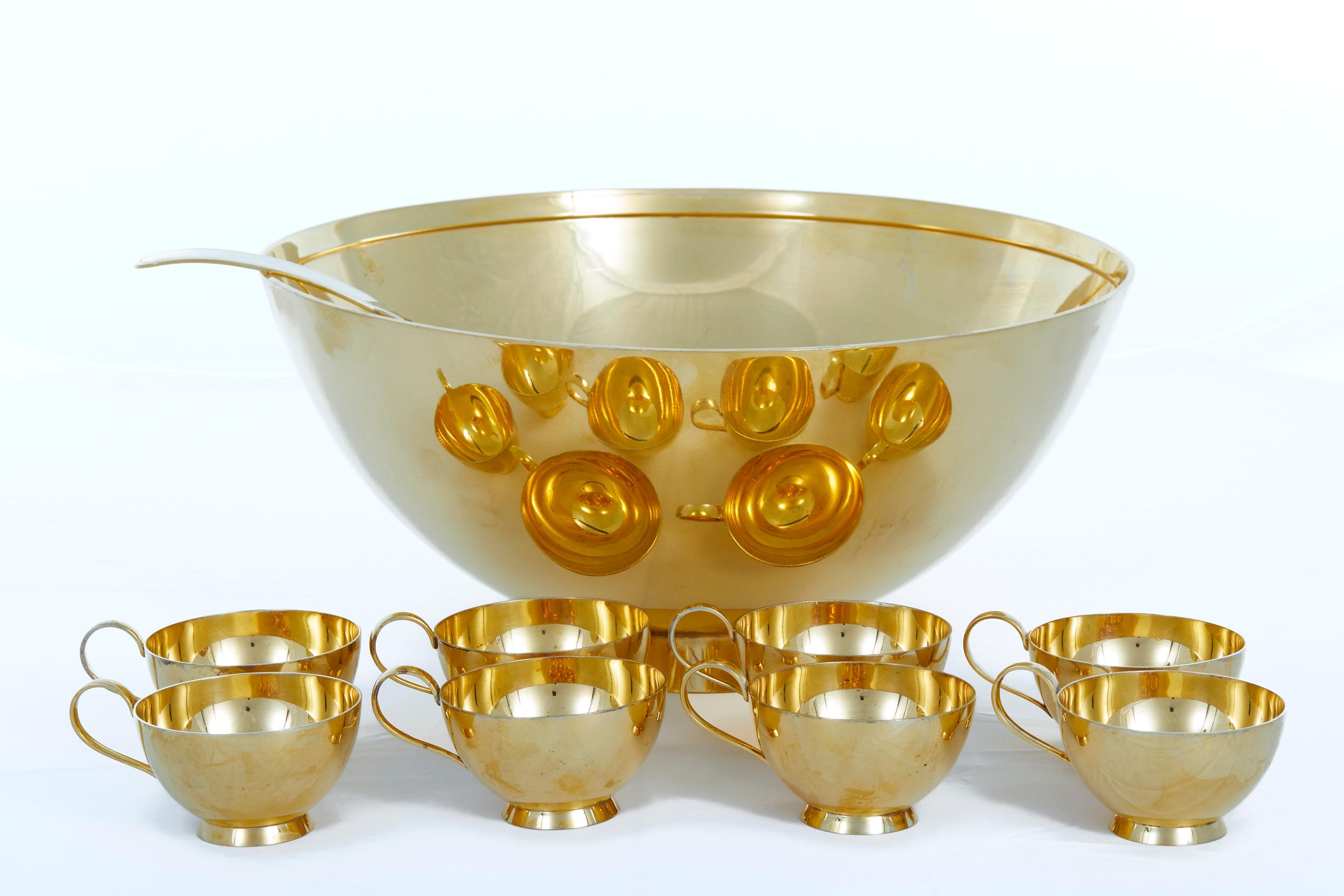 Tiffany & Co. sterling silver / gilt barware / tableware art deco style punch bowl service for eight people . The set include 10 piece altogether. Eight drinking cup. One large punch bowl. One serving ladle. Each piece is in great condition. Minor