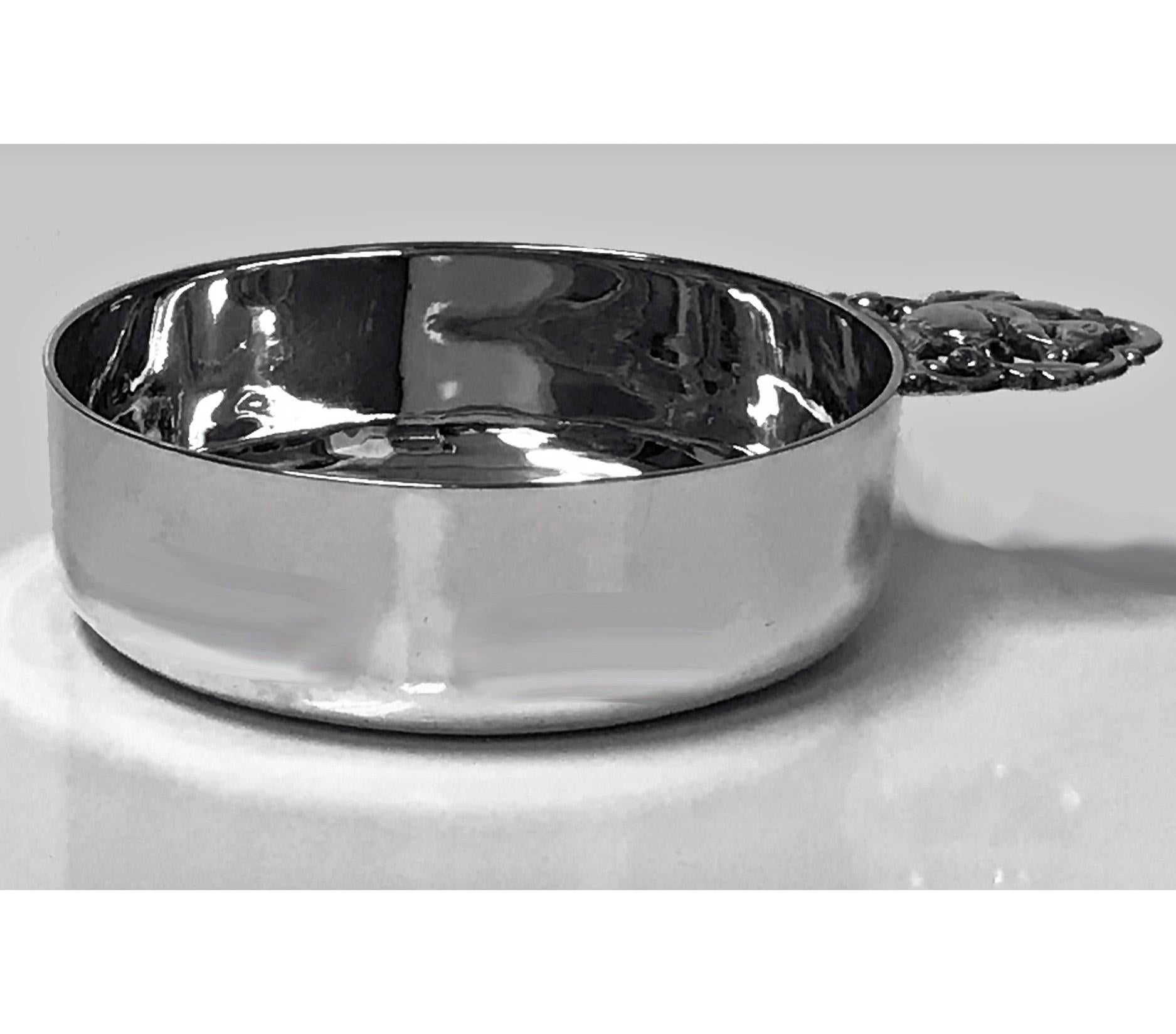 Tiffany & Co. sterling silver porringer with squirrel handle, 1907-1938. Solid and heavy, plain with squirrel handle with oak leaves and acorns. Stamped Tiffany & Co. Makers Sterling Silver 23111 with m mark for 1907-1938. Measures: Length 6 inches,