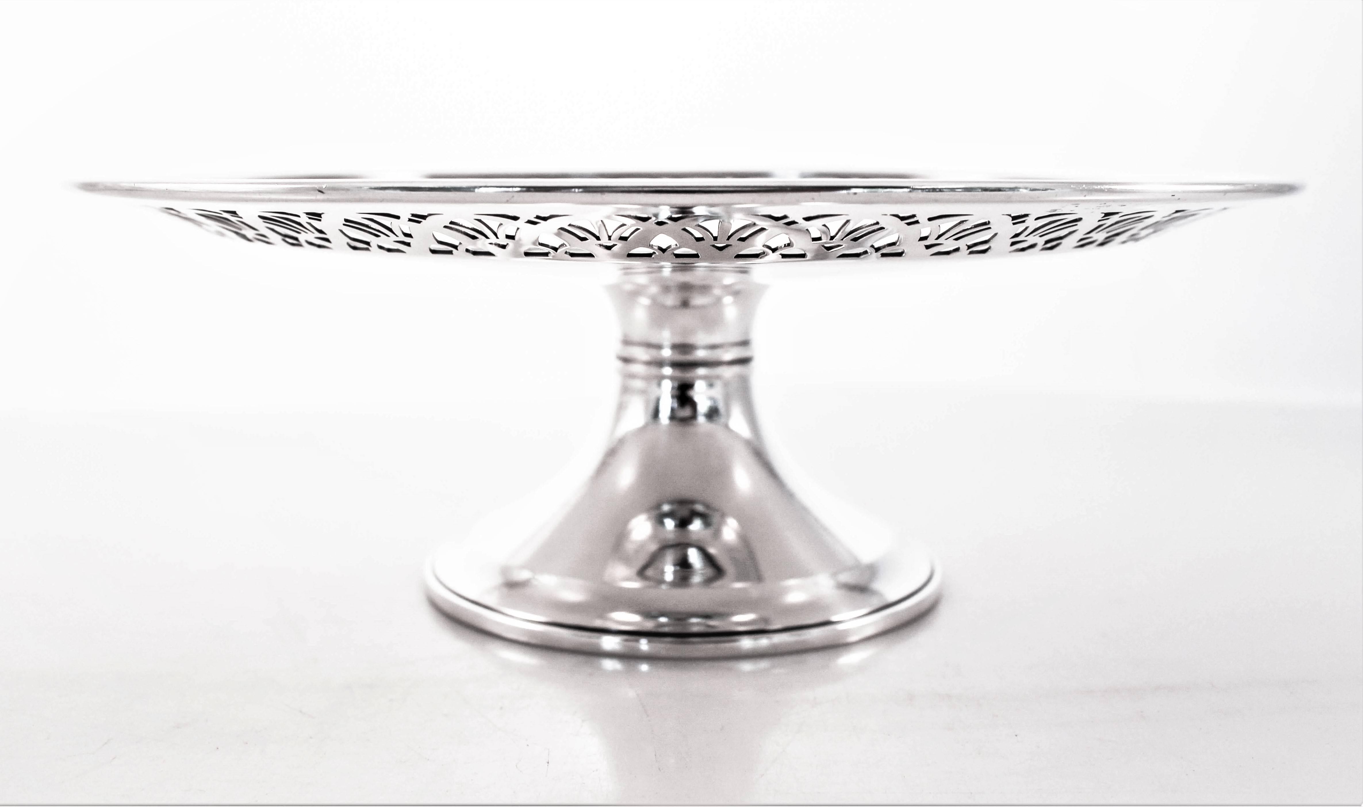 Tiffany & Co. tazz with pretty cutouts around the entire rim. It stands on a pedestal and is not weighted. In the center there is a cartouche— a space for your monogram. A practical size for desserts or appetizers.
 