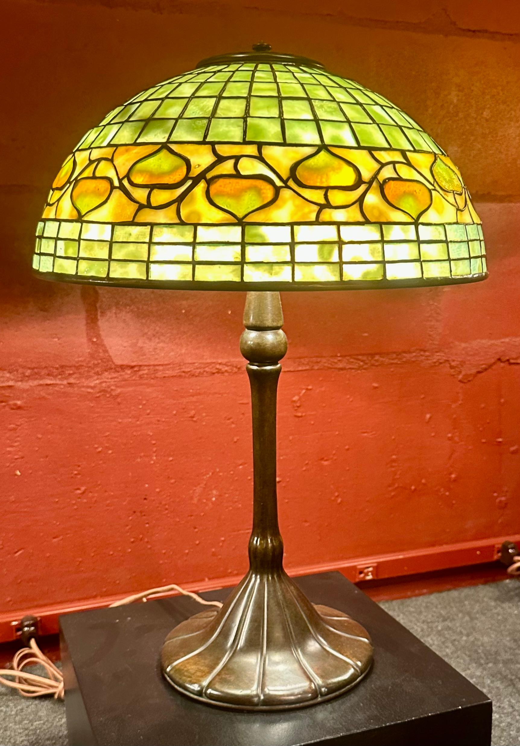 A Tiffany Studios 14” “Acorn” leaded lamp shade signed “Tiffany Studios, New York” & numbered 