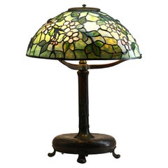 TIFFANY STUDIOS (1899-1920) "Apple Blossom" Leaded Glass and Bronze Table Lamp