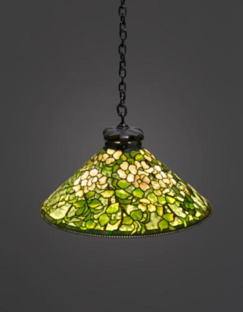 Original Tiffany Studios Dogwood hanging shade (American, est. 1902 1938) The Tiffany Studios stamp is located within the rim of the shade. There are six lights within the shade and illuminates and highlights the green exterior of the shade. This