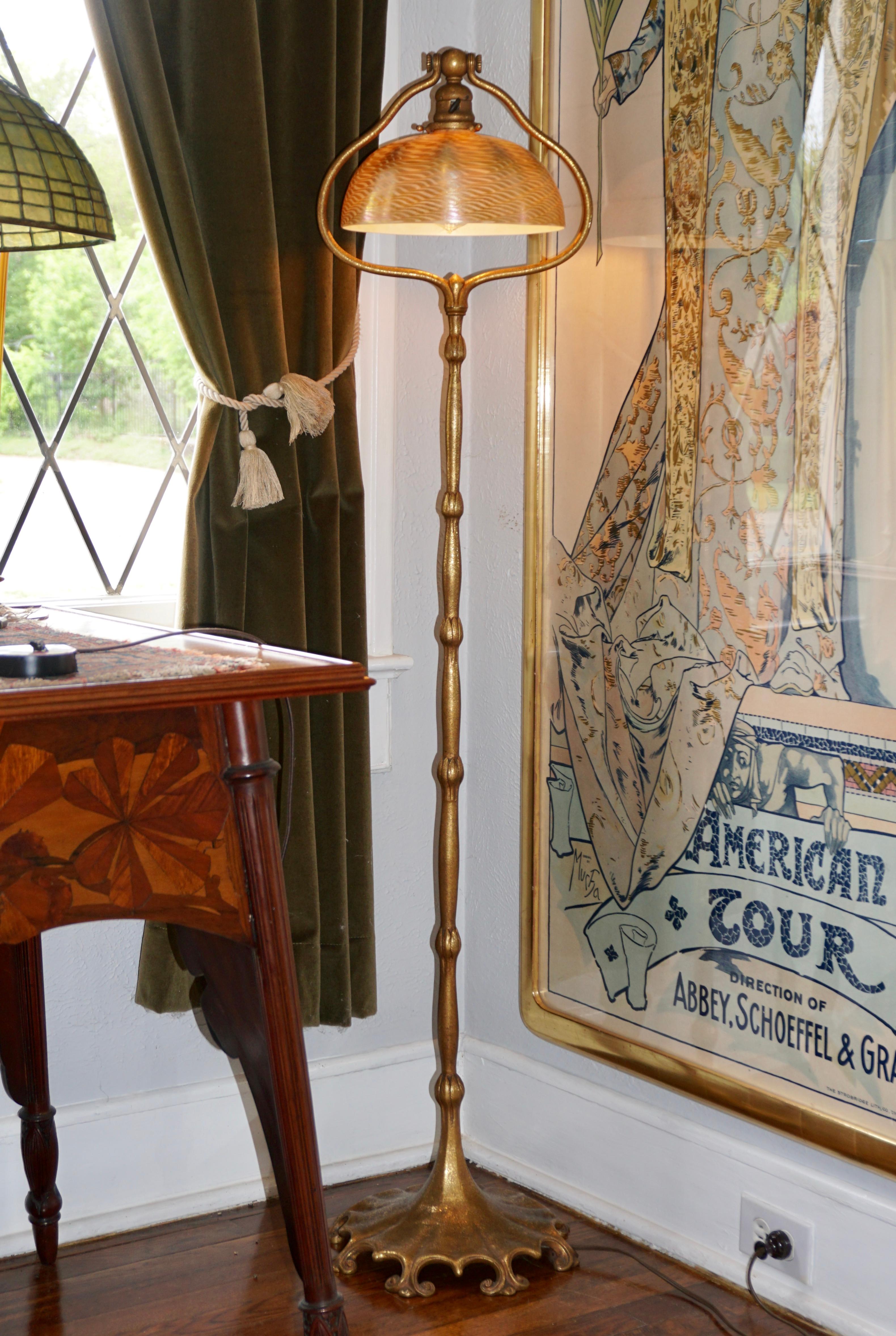 Tiffany Studios damascene floor lamp. 

This exceptional Tiffany Studios floor lamp has a bronze harp base with a wonderful orange peel textured gilt gold patinated patina and ornate decorative footing. Base supports a gold damascene shade with gold