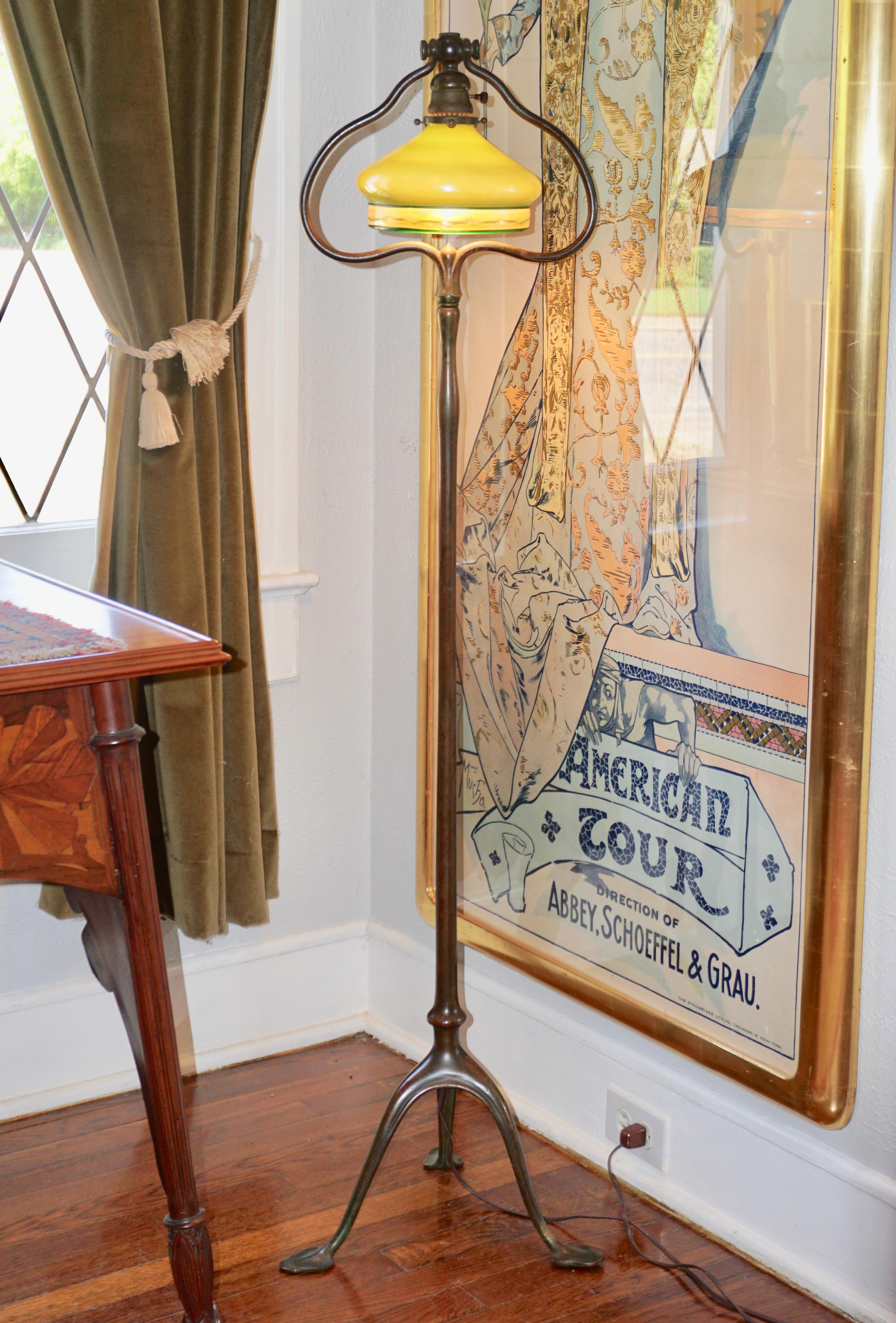 A delightful Tiffany Studios tripod standing floor lamp. Lamp base underside stamped 