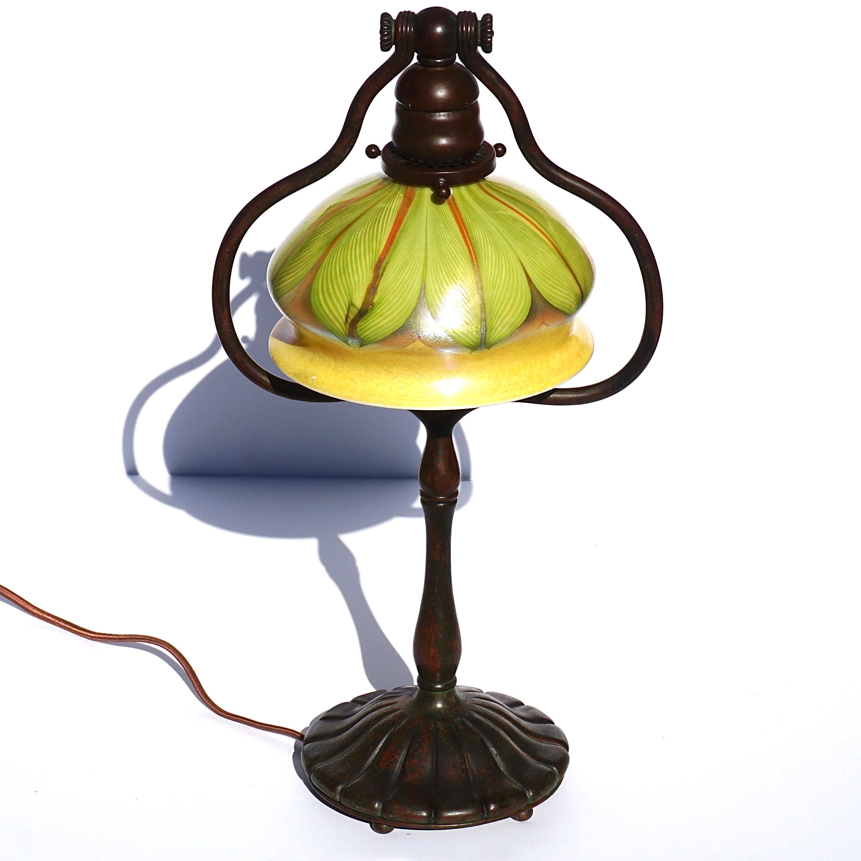 A wonderful Tiffany Studios and Louis Comfort Tiffany table lamp, circa 1900
This Art Nouveau lamp would make for a wonderful gift, an excellent investment and adds class to any setting.

Bronze base with an excellent original patina, signed