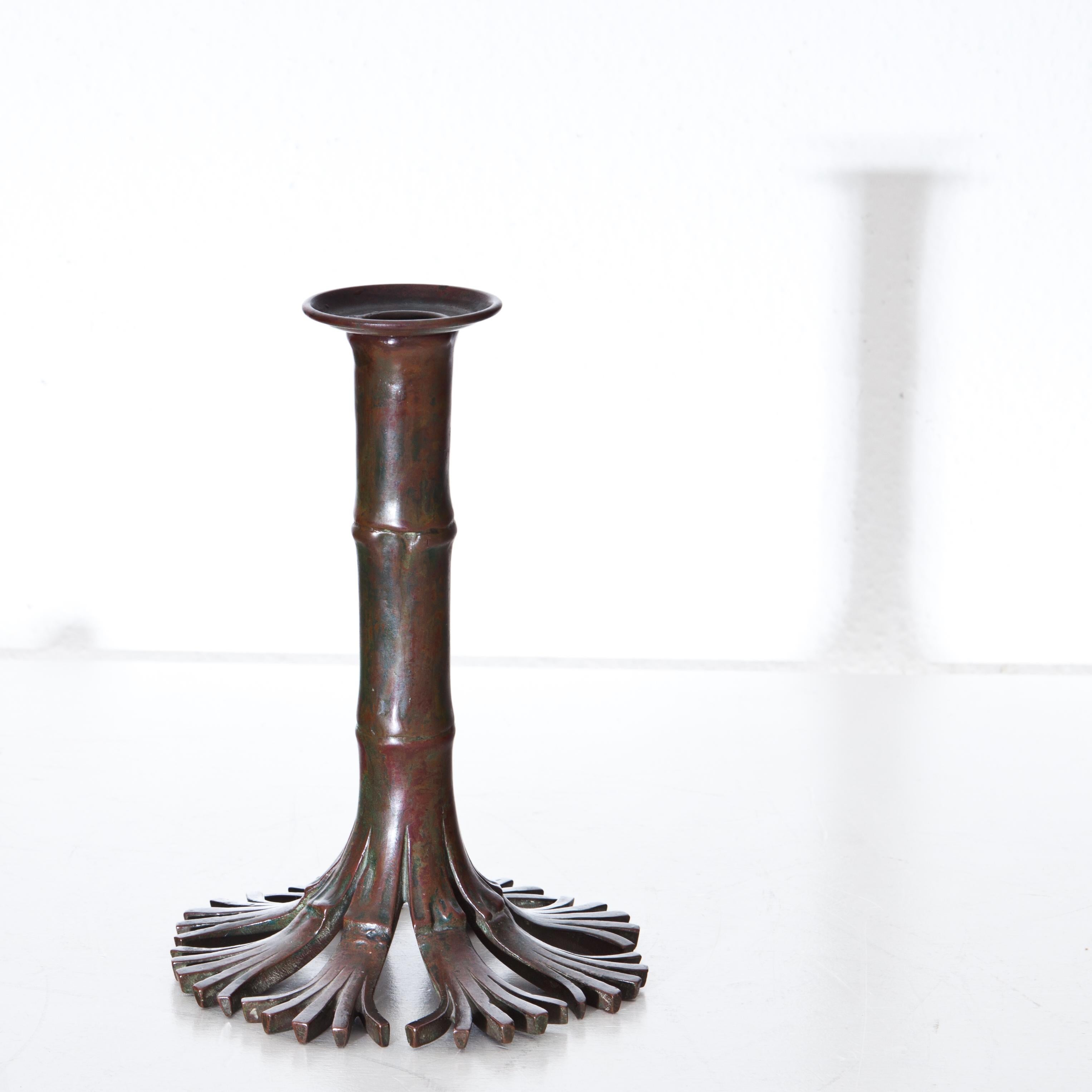 Bronze candlestick in bamboo look from Tiffany Studios New York, model number 1206. Stamped on the base.