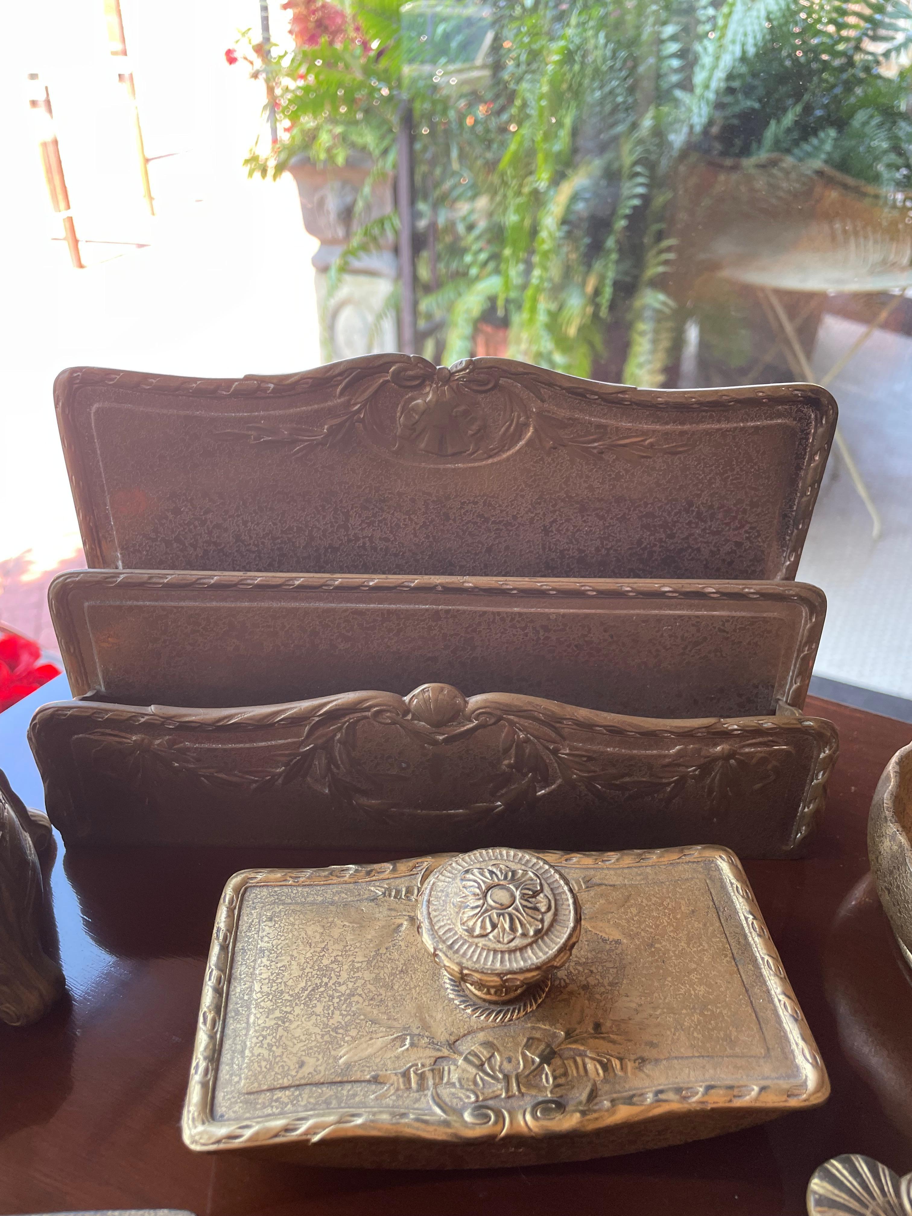 9-Piece Tiffany Studios Bronze Desk Set which includes: Letter Holder, Notepad Holder, Letter Opener, Stamp Box, Pen Tray, Blotter, Ink Well, Vase Base, Nut Bowl with Scalloped Edges