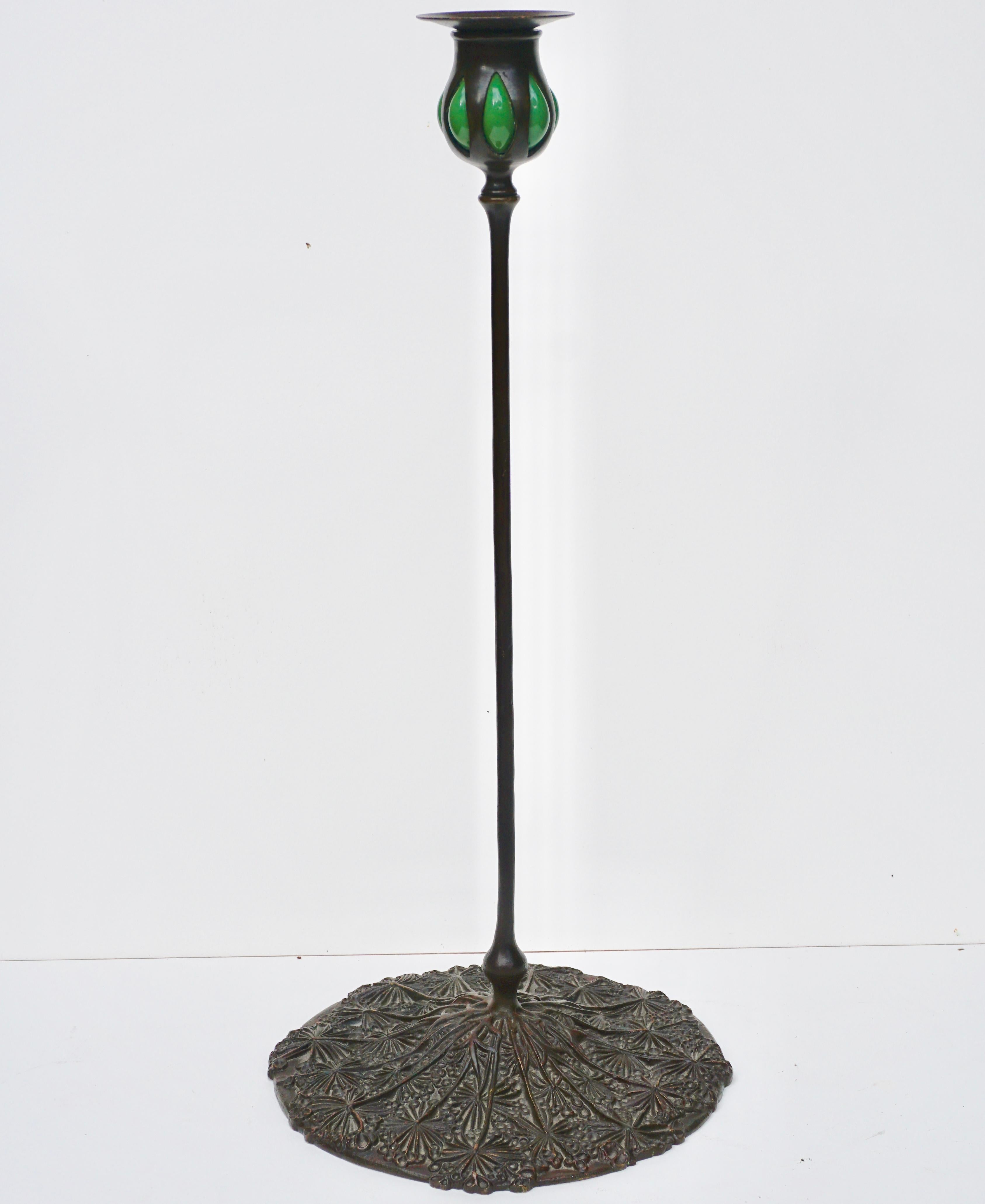 Tiffany Studios New York
Queen Anne's Lace blown-out candlestick, New York, circa 1900.
Patinated bronze, blown glass. A very decorative Art Nouveau - Art Deco candle stick lamp.

Stamped TGDCO. TIFFANY STUDIOS NEW YORK D555

Measures: Height