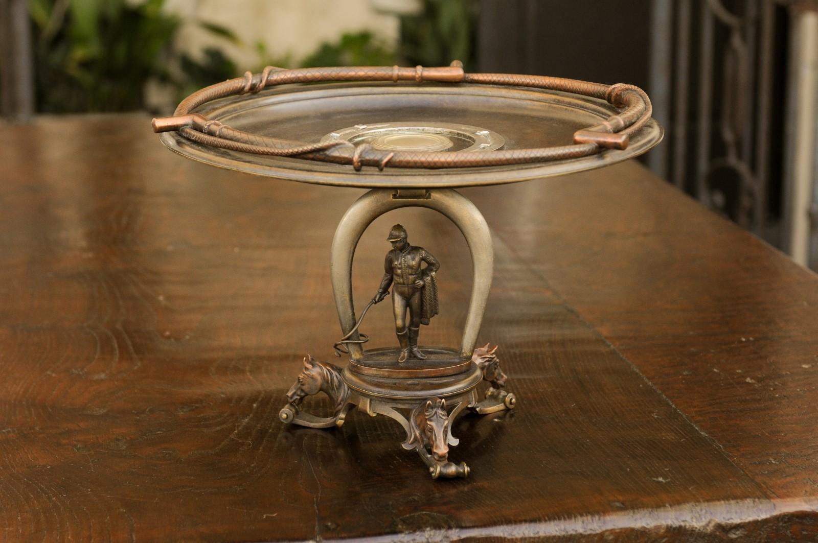 A Tiffany Studios bronze tazza from the early 20th century, with equestrian motifs. Born in second decade of the 20th century, this exquisite bronze tazza features a circular bowl, adorned with a flat horseshoe in its centre and whips on its trime.