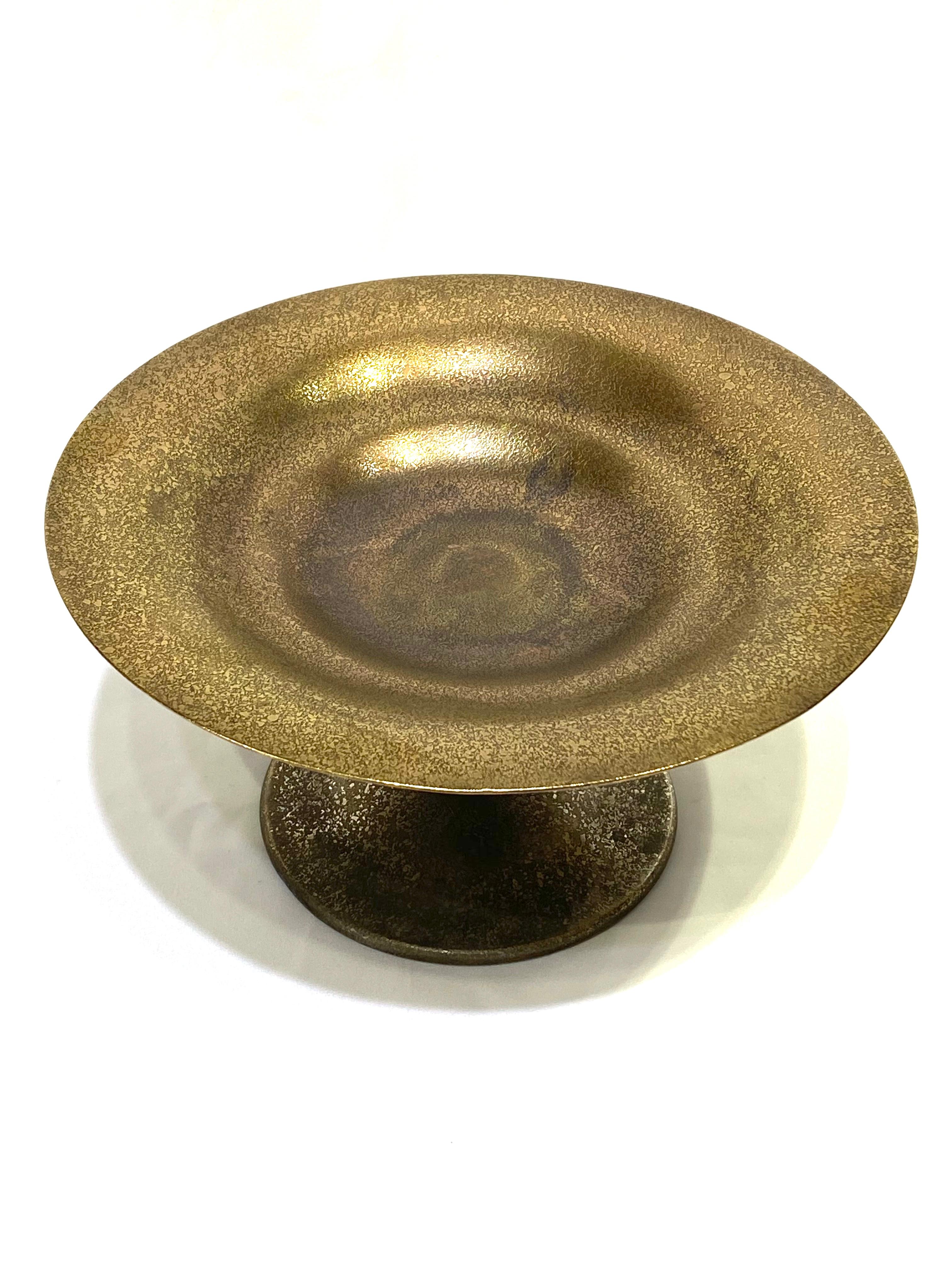 Product details:

Circa 1920- 1930
Bronze tazza, decorative dish.
Signed Tiffany Studios, New York. Numbered 1665.
Made in USA.