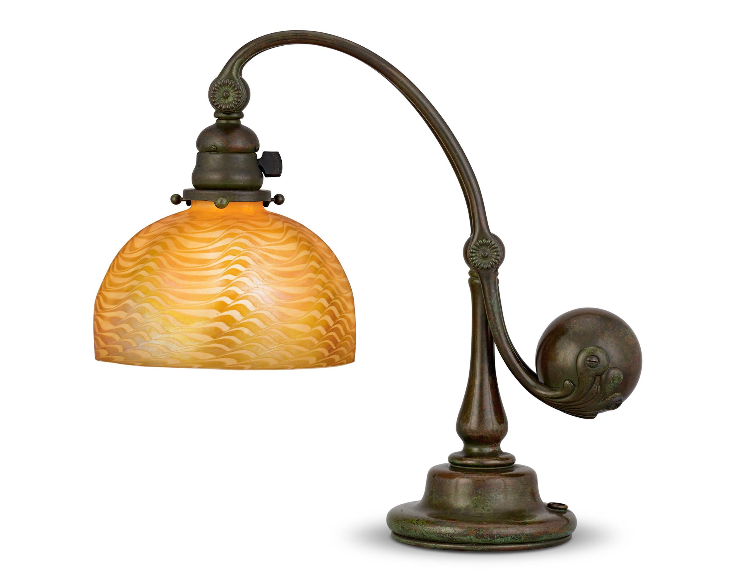 Counter Balance Desk Lamp
Louis Comfort Tiffany
Circa 1900

Designed by the iconic Louis Comfort Tiffany, this exceptional desk lamp is the pinnacle of Art Nouveau design. The original patinated bronze base is one of his rare counterbalance models,