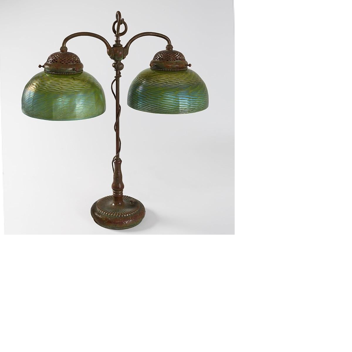 A Tiffany Studios New York patinated bronze and Favrile glass 