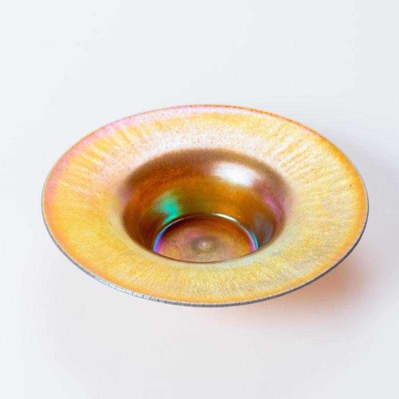 Large flaring rim onion skin blown glass Favrile center bowl. Signed and numbered on the underfoot: L.C. Tiffany, Favrile, No. 7560. American, 1885-1892.