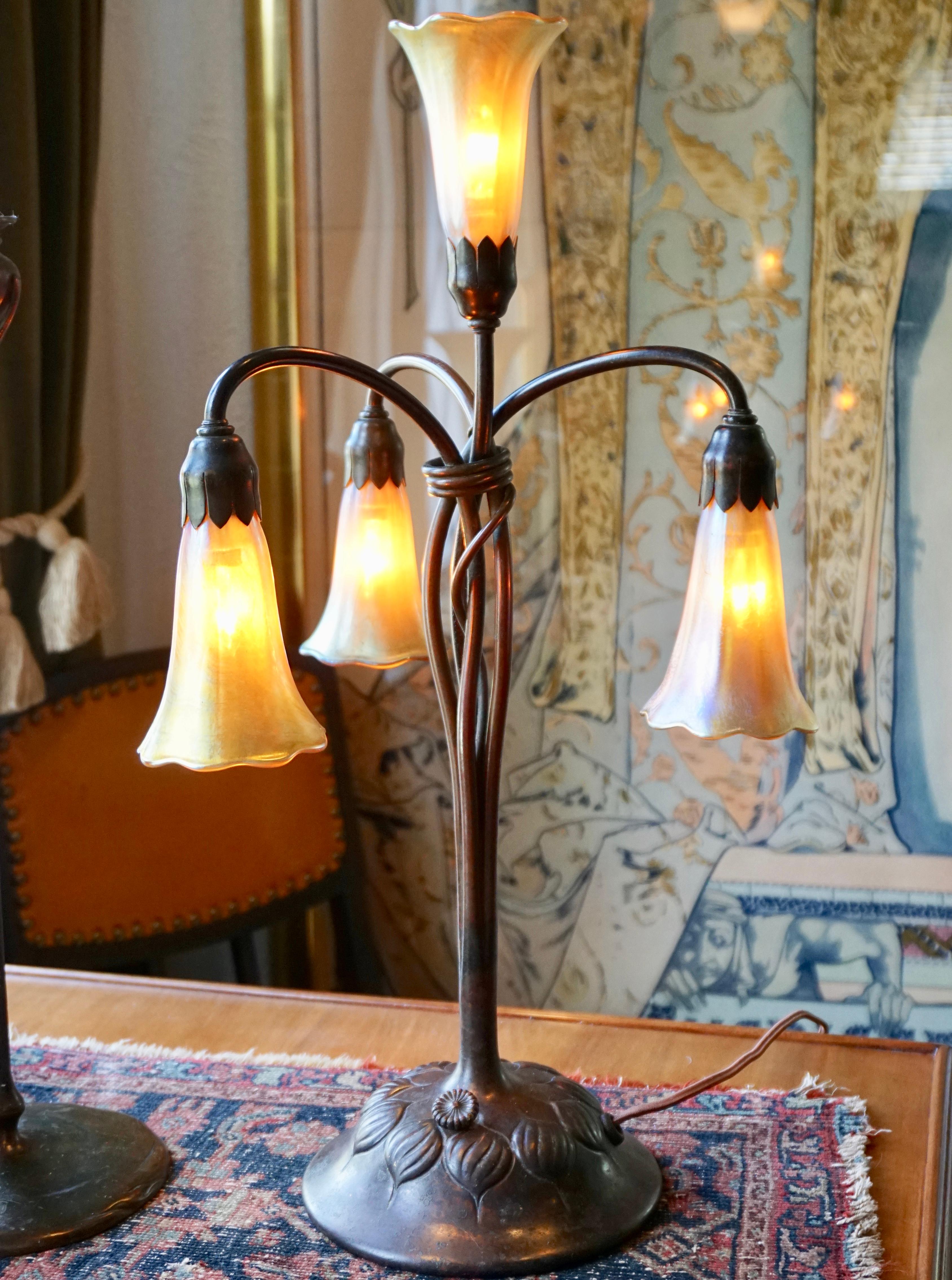 An American Art Nouveau patinated bronze and favrile glass 