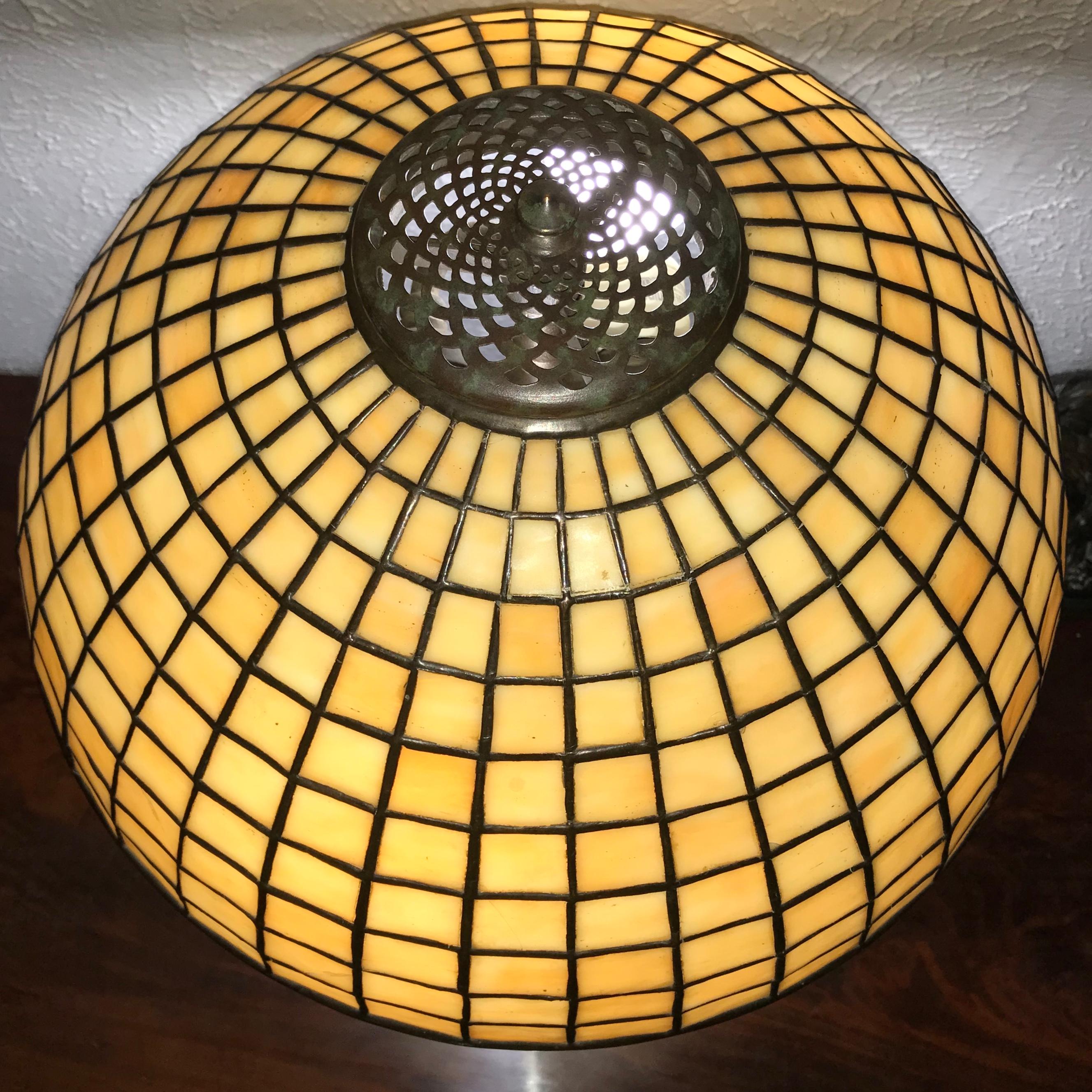 Tiffany Studios leaded glass and bronze geometric table lamp,
circa 1910 Art Nouveau - Art Deco transition.

A delightful Tiffany Studios Lamp for that special place in your home. The size would be perfect for a bedroom or office desk as well as any
