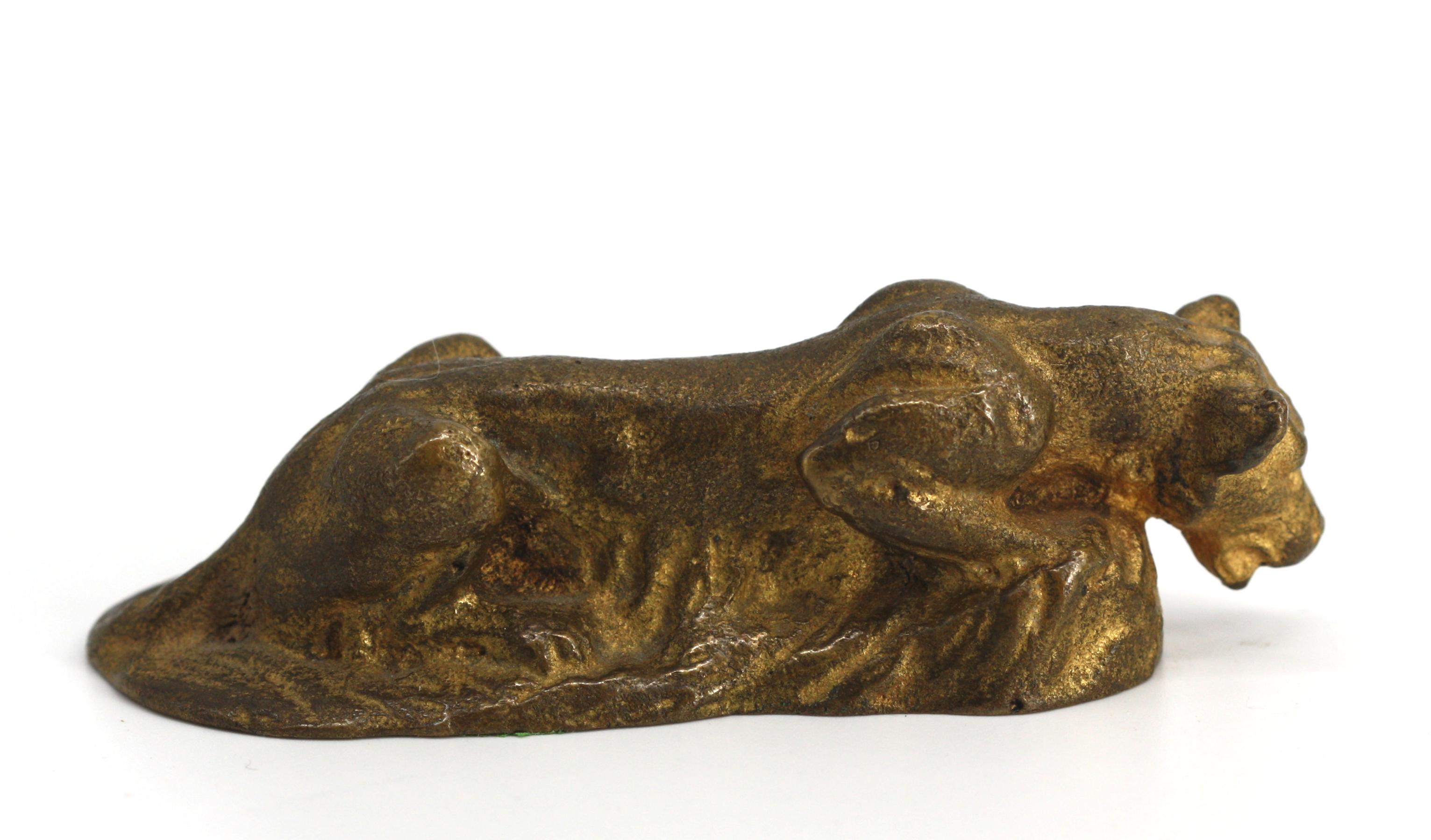 
Tiffany Studios Gilt Bronze Lioness.
The underside marked, Tiffany Studios, New York, 8(?)7. The lioness haunched over rock work.
Height 1.25 in., Length 4 in.,