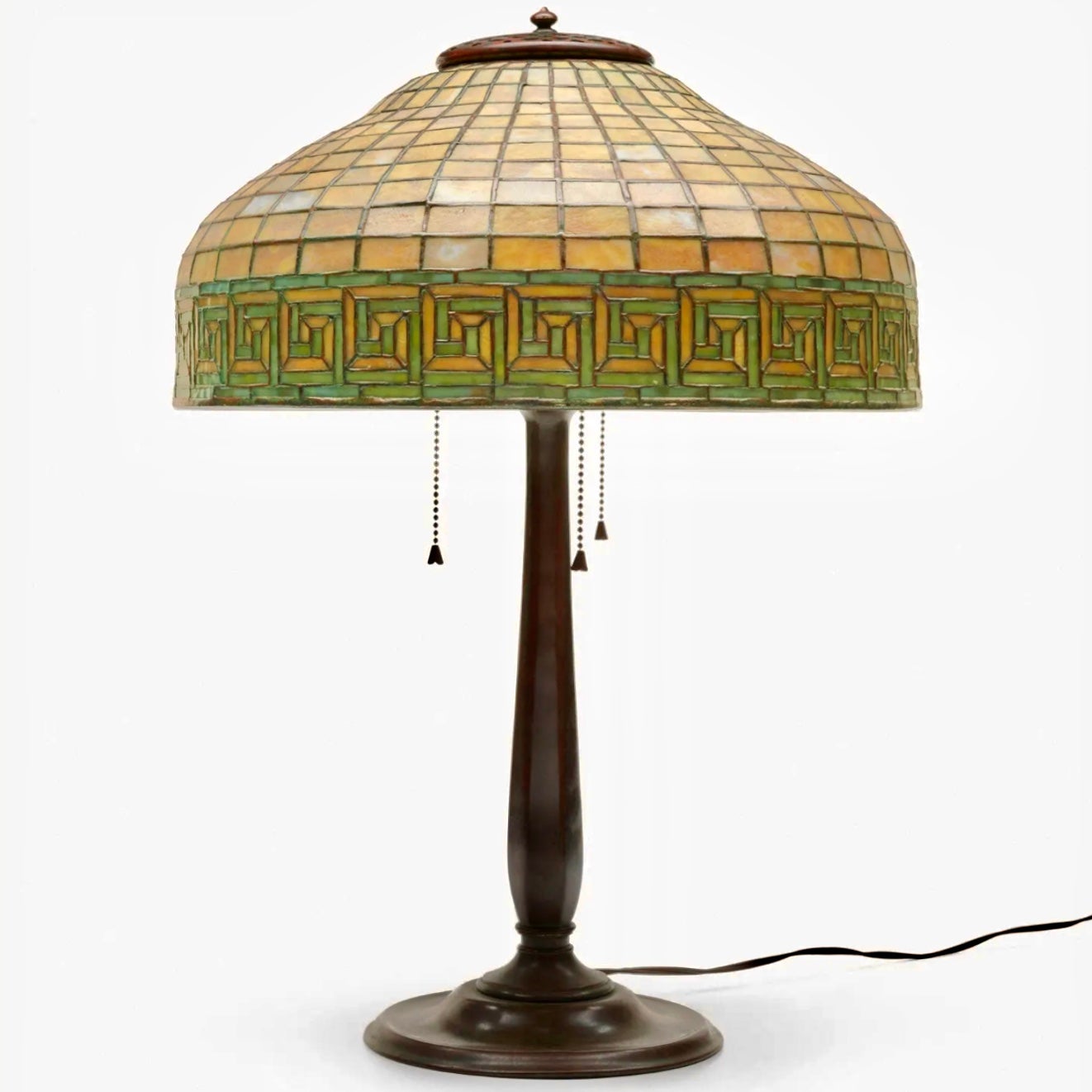 Tiffany Studios New York Geometric Greek Key Table Lamp
New York circa. 1910
Leaded glass, Patinated bronze
Dimensions: 22.25 Inches High
Diameter: 16 Inches
(57 x 41 cm)

Condition: Excellent with no damage or repairs. No heat cracks detected with
