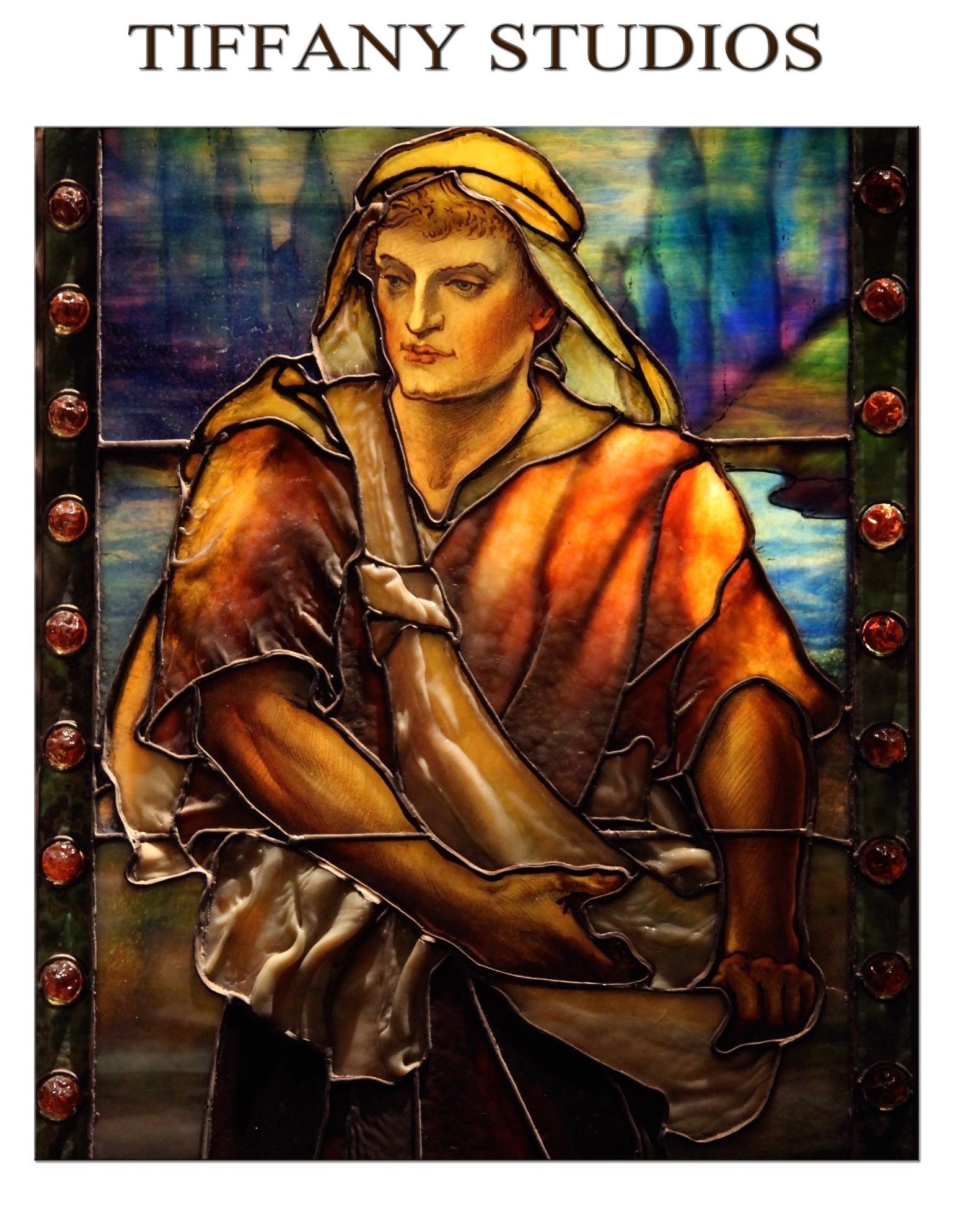 Museum quality Tiffany Stidios figural leaded art glass window depicts a young man tossing seeds from his sash into a feral field. 
Highly Executed with thick drapery and tiffany furnace glass in multiple front and back layers consting of colbolt