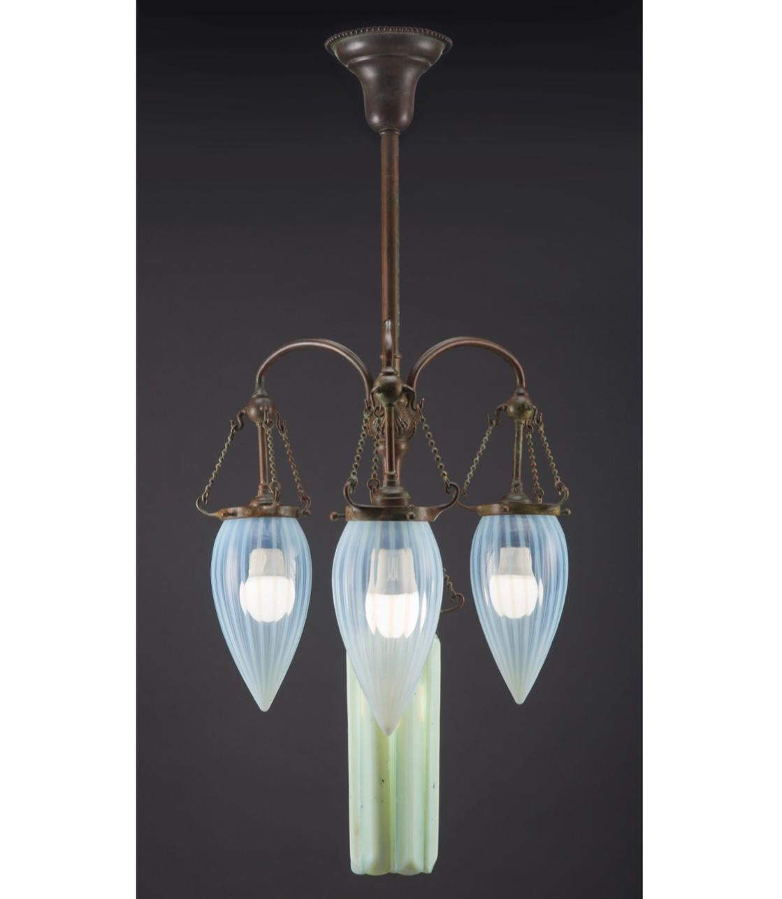 Tiffany Studios Favrile glass and patinated bronze Moorish lamp, circa 1900
In absolutely excellent condition; this chandelier will make and room it lights up. It is much larger that the photos depict. At almost 33 inches tall; the prisms are 10