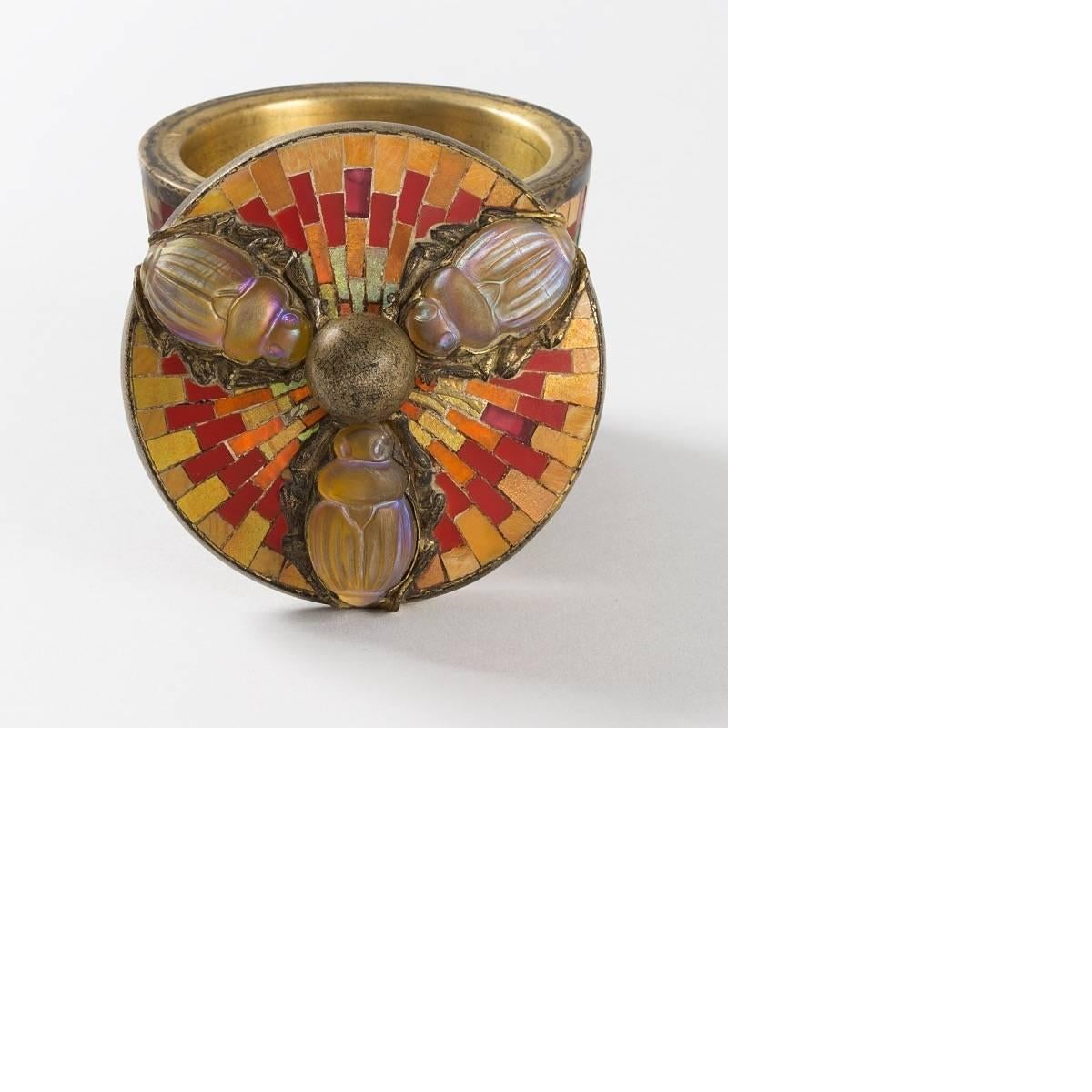 An incredibly rare example of Louis Comfort Tiffany's work in small scale, this round Tiffany Studios New York 