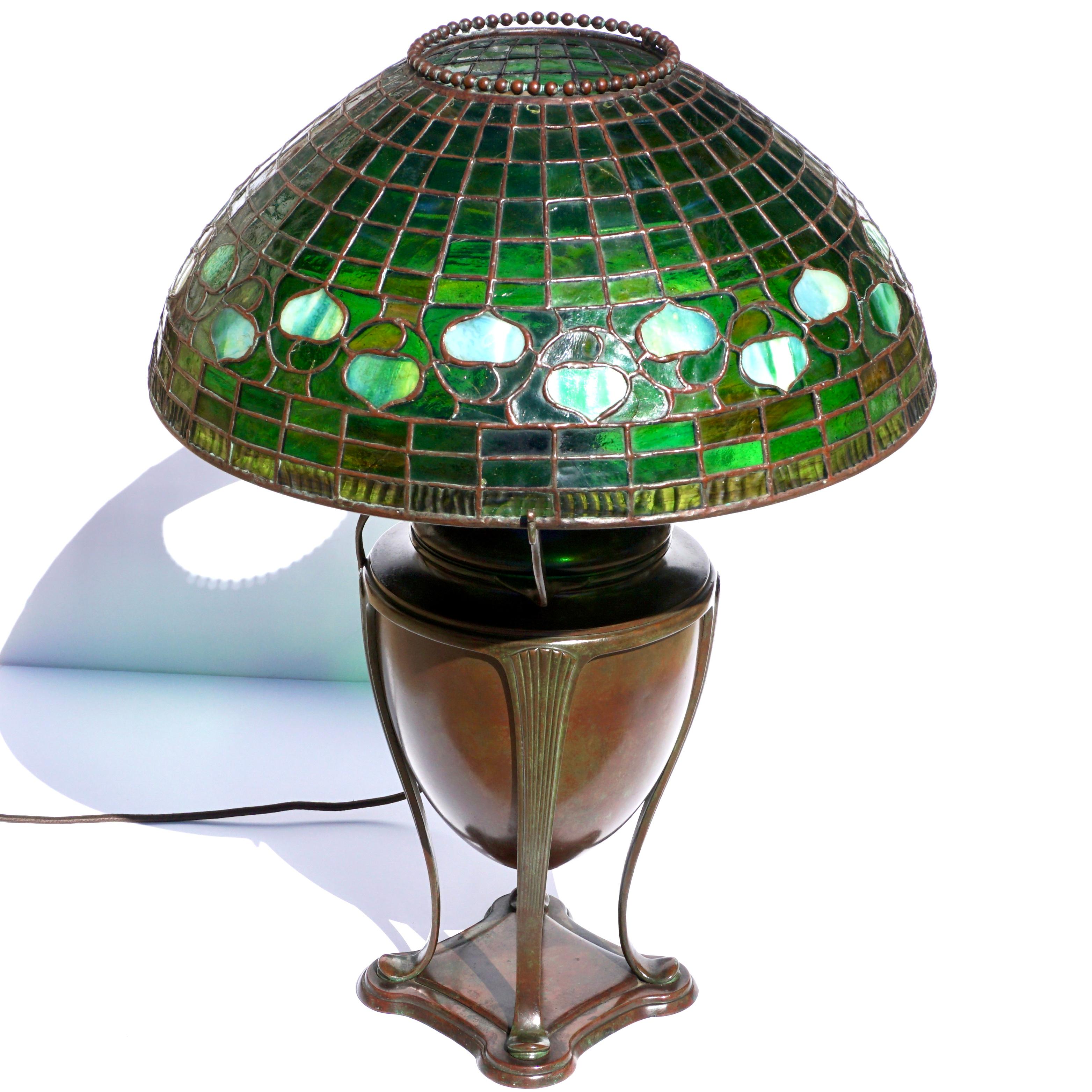 A Tiffany Studios Acorn leaded Glass And Bronze Table Lamp. Circa 1895. 

This lamp is an early example. Circa the 1890s; Tiffany was developing what would become the common table lamp. With the onset of electricity and the demise of oil lamps came