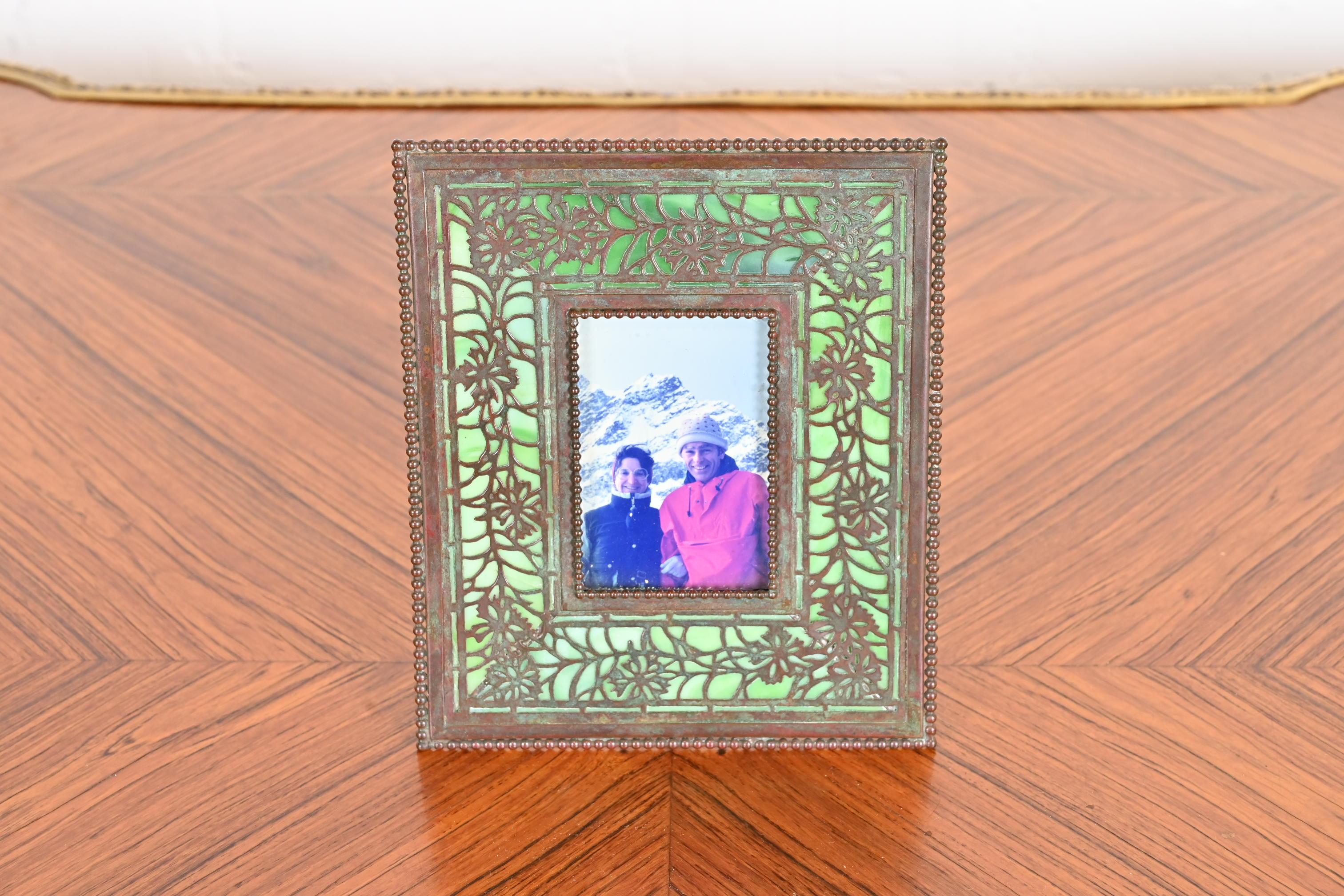 A gorgeous antique Art Nouveau picture frame

By Tiffany Studios

New York, USA, Early 20th century

Measures: 6.5