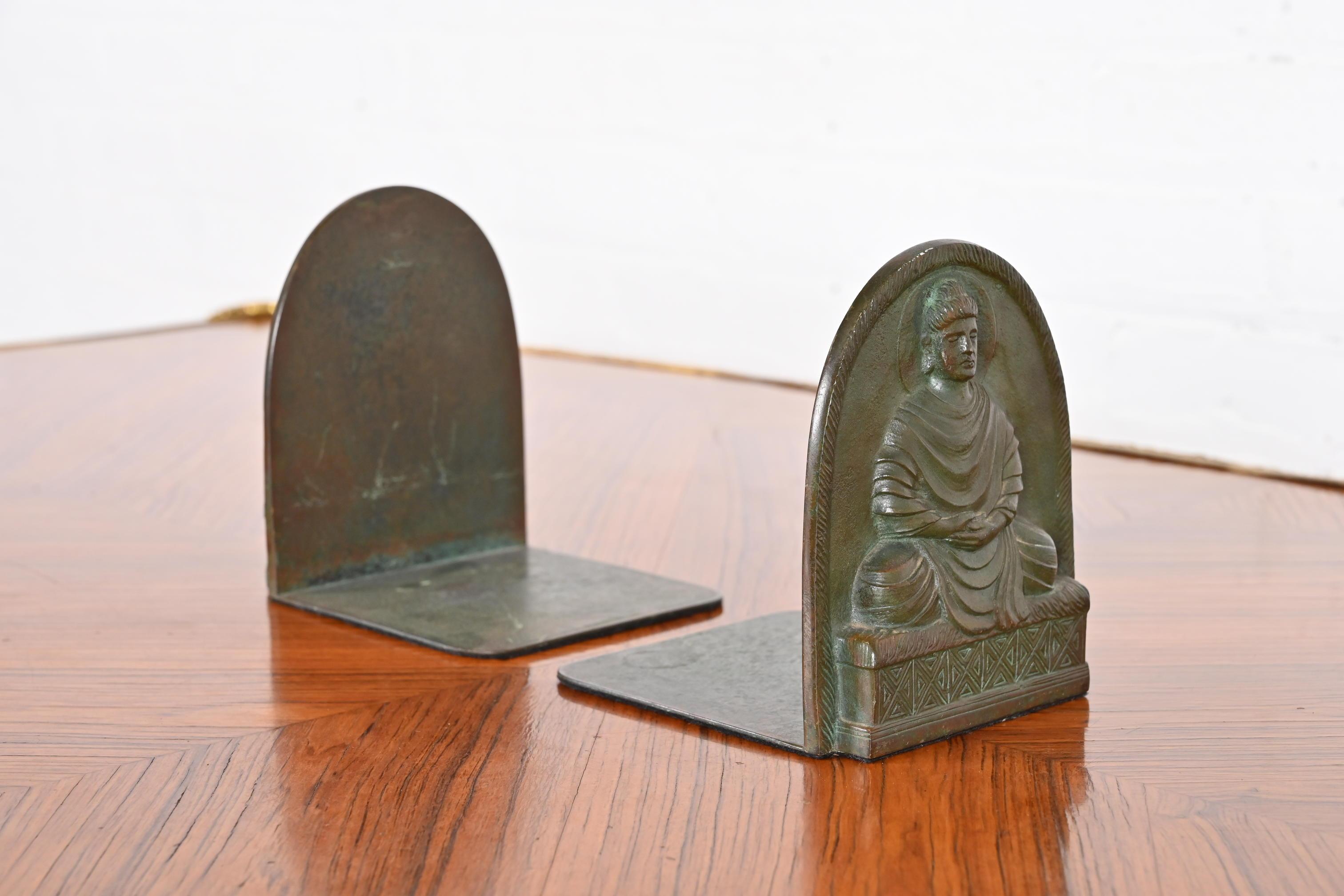 A gorgeous pair of bronze bookends featuring Buddha

By Tiffany Studios

New York, USA, Early 20th Century

Measures: 4.75