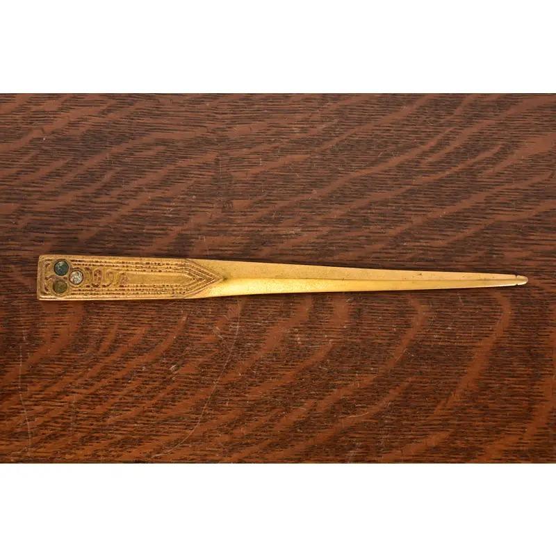 A gorgeous antique Arts & Crafts or Art Deco period gilt bronze and inlaid abalone letter opener

By Tiffany Studios

New York, USA, early 20th century

Measures: 10