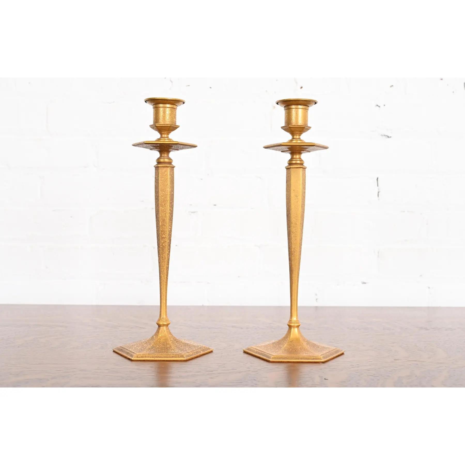 A gorgeous pair of Arts & Crafts or Art Nouveau period gilt bronze candlesticks

By Tiffany Studios (each signed to the underside)

New York, USA, Early 20th Century

Measures: 5