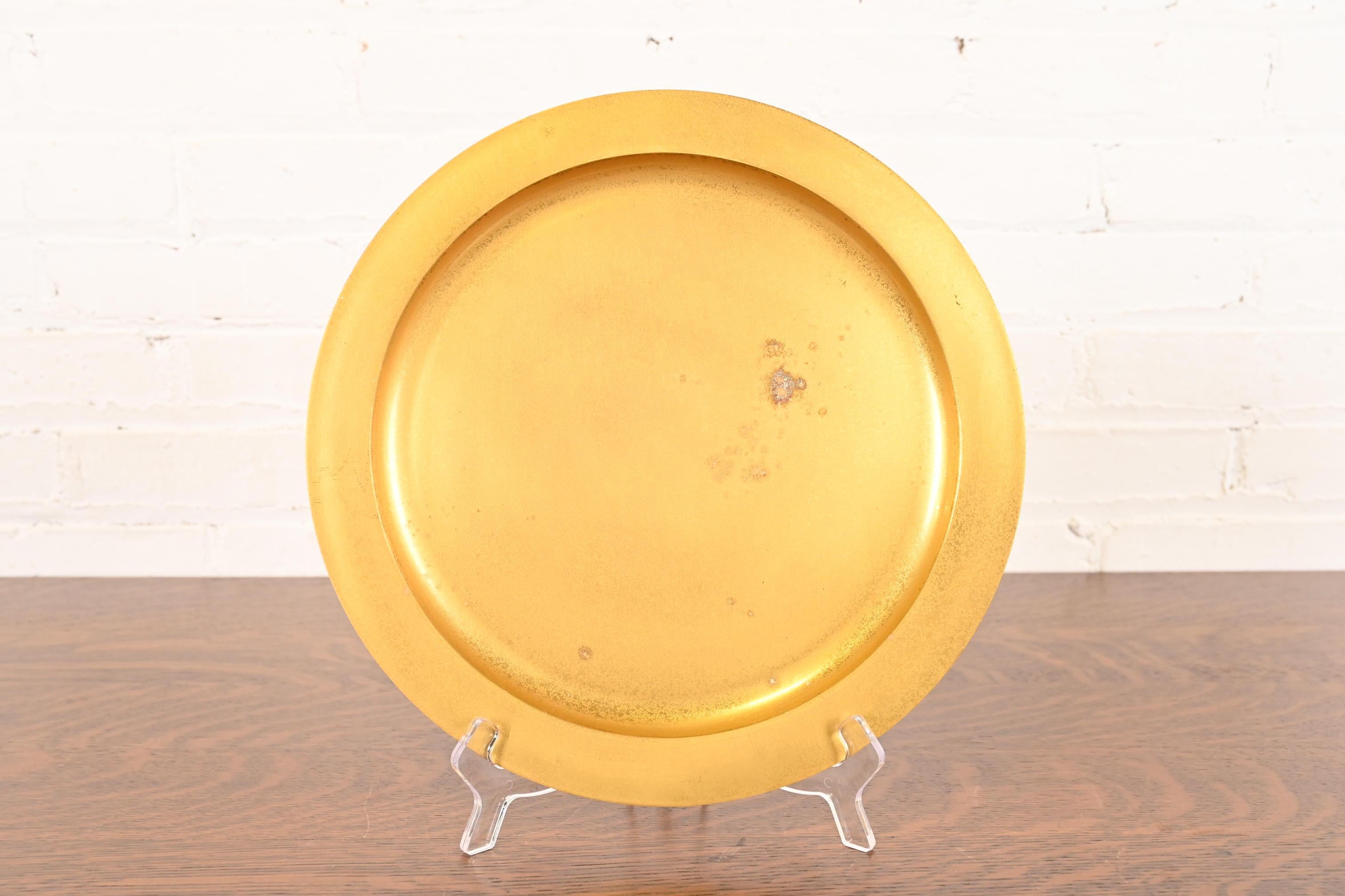 A gorgeous Arts & Crafts or Art Deco period gilt bronze large plate or charger

By Tiffany Studios (signed to the underside)

New York, USA, Early 20th Century

Measures: 12.13