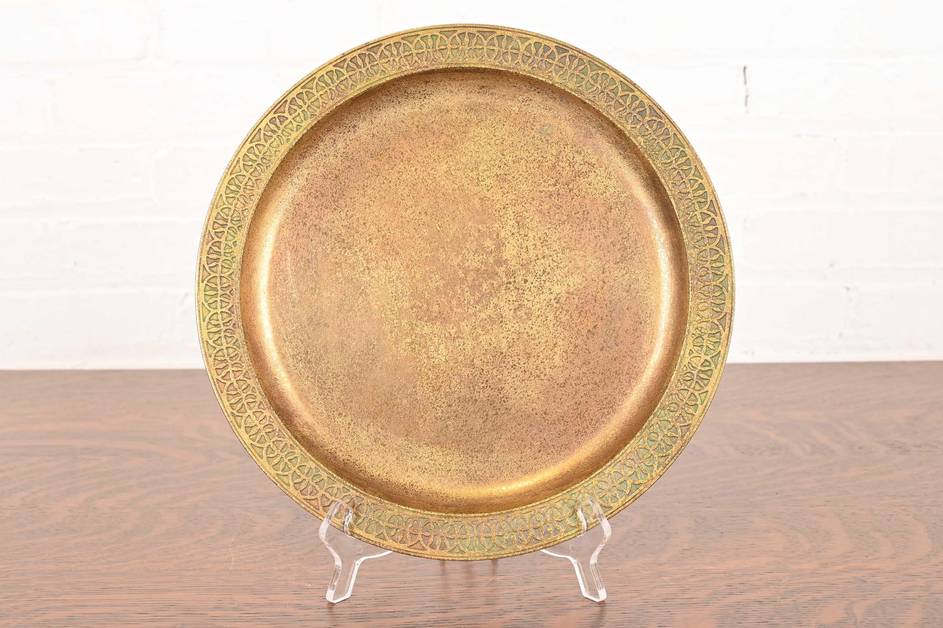 A gorgeous Arts & Crafts or Art Deco period gilt bronze plate or charger

By Tiffany Studios (signed to the underside)

New York, USA, Early 20th Century

Measures: 12
