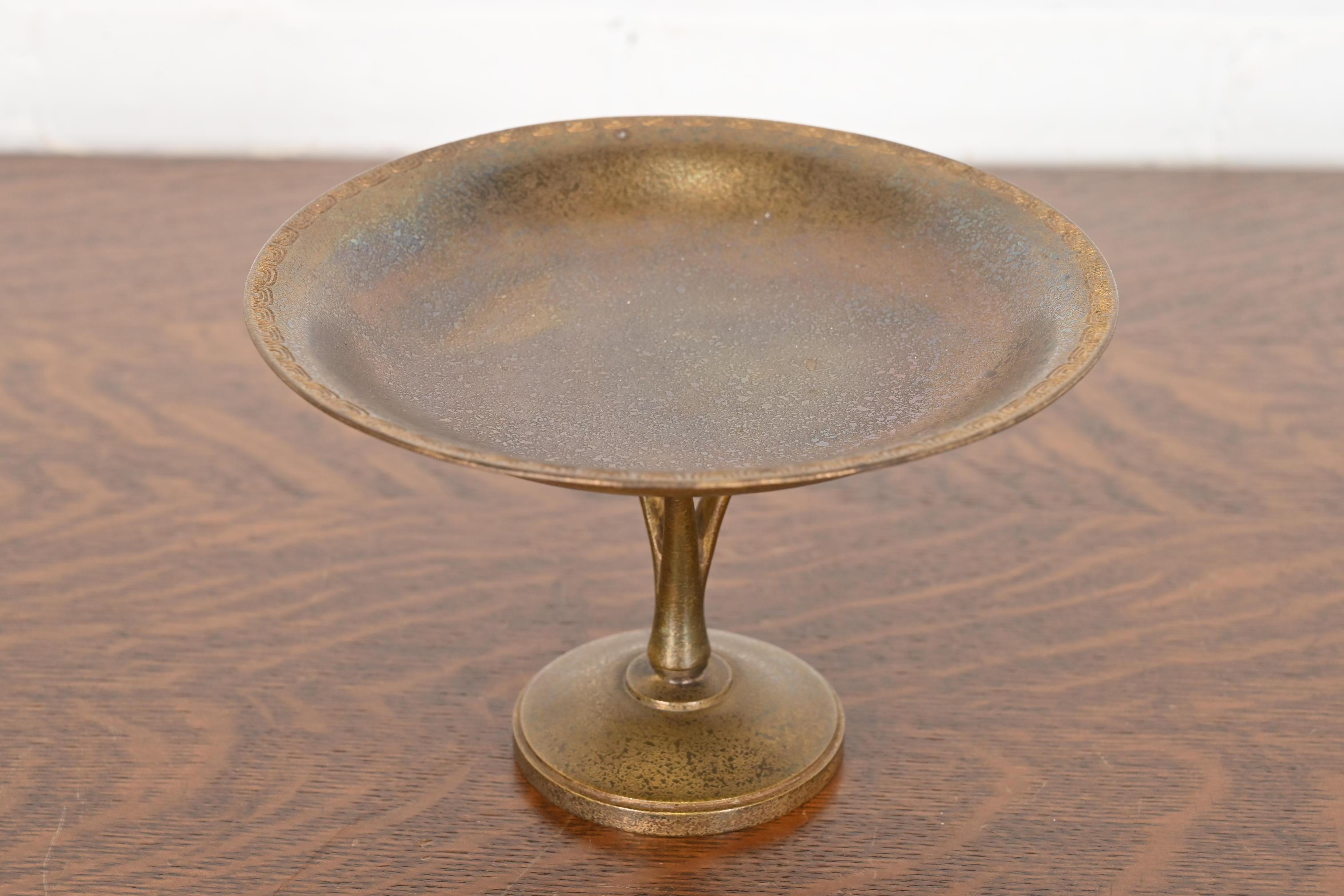 A gorgeous Arts & Crafts or Art Deco period bronze pedestal bowl or compote dish

By Tiffany Studios (signed to the underside)

New York, USA, Early 20th Century

Measures: 7.13