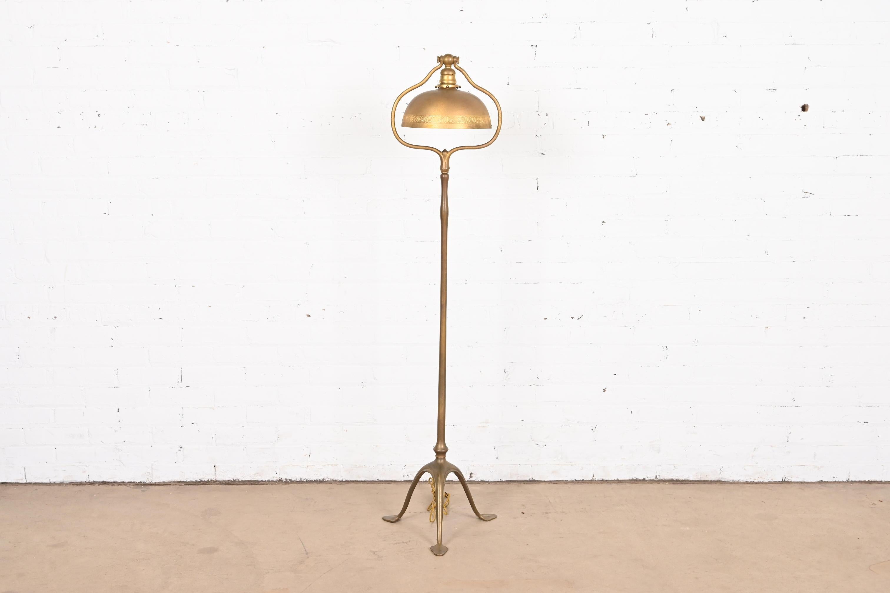 An outstanding Arts & Crafts or Art Deco period floor lamp

By Tiffany Studios (signed to the underside of one foot)

New York, USA, Early 20th Century

Gilt bronze stand, with gorgeous original domed gilt bronze shade with decorate