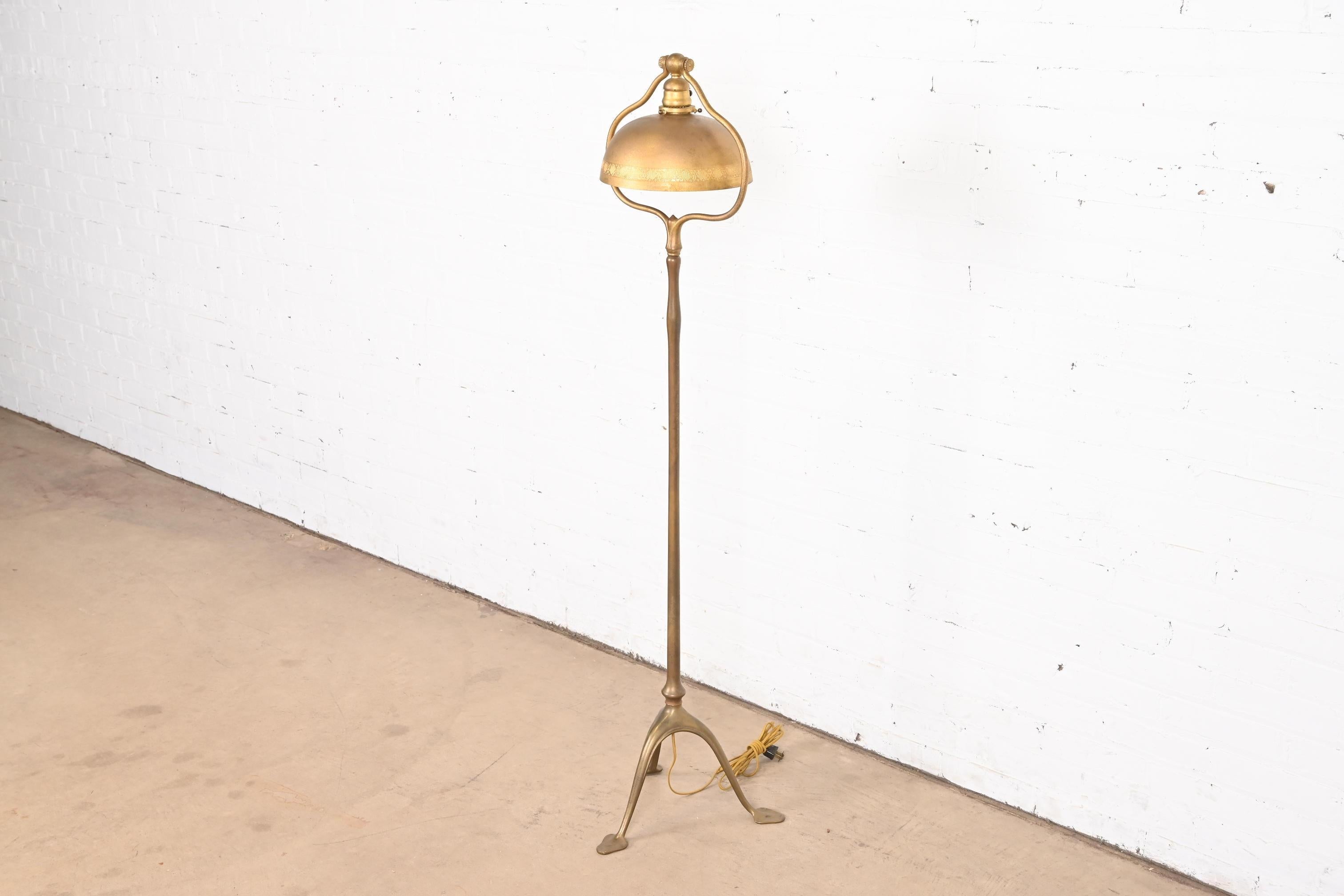 An outstanding Arts & Crafts or Art Deco period floor lamp

By Tiffany Studios (signed to the underside of one foot)

New York, USA, Early 20th Century

Gilt bronze stand, with gorgeous original domed gilt bronze shade with decorate