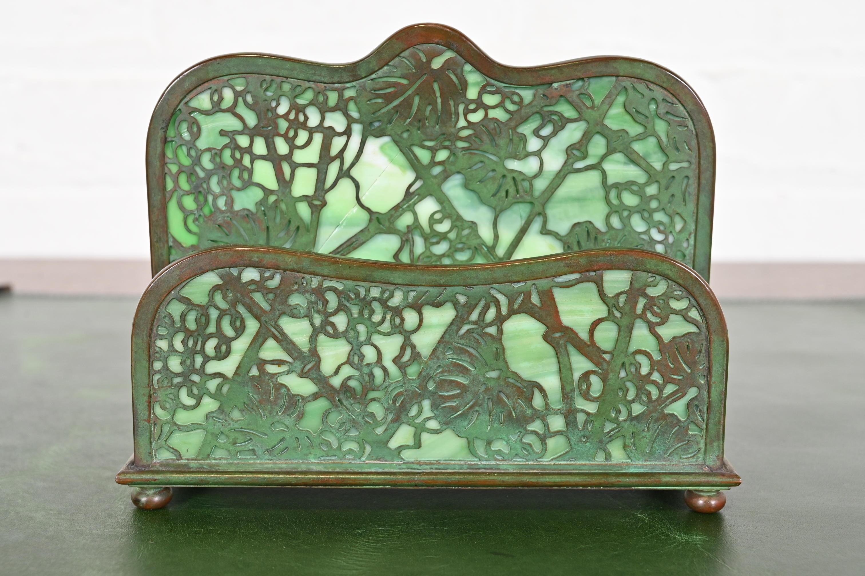 A gorgeous antique Arts & Crafts or Art Deco period bronze and slag glass 