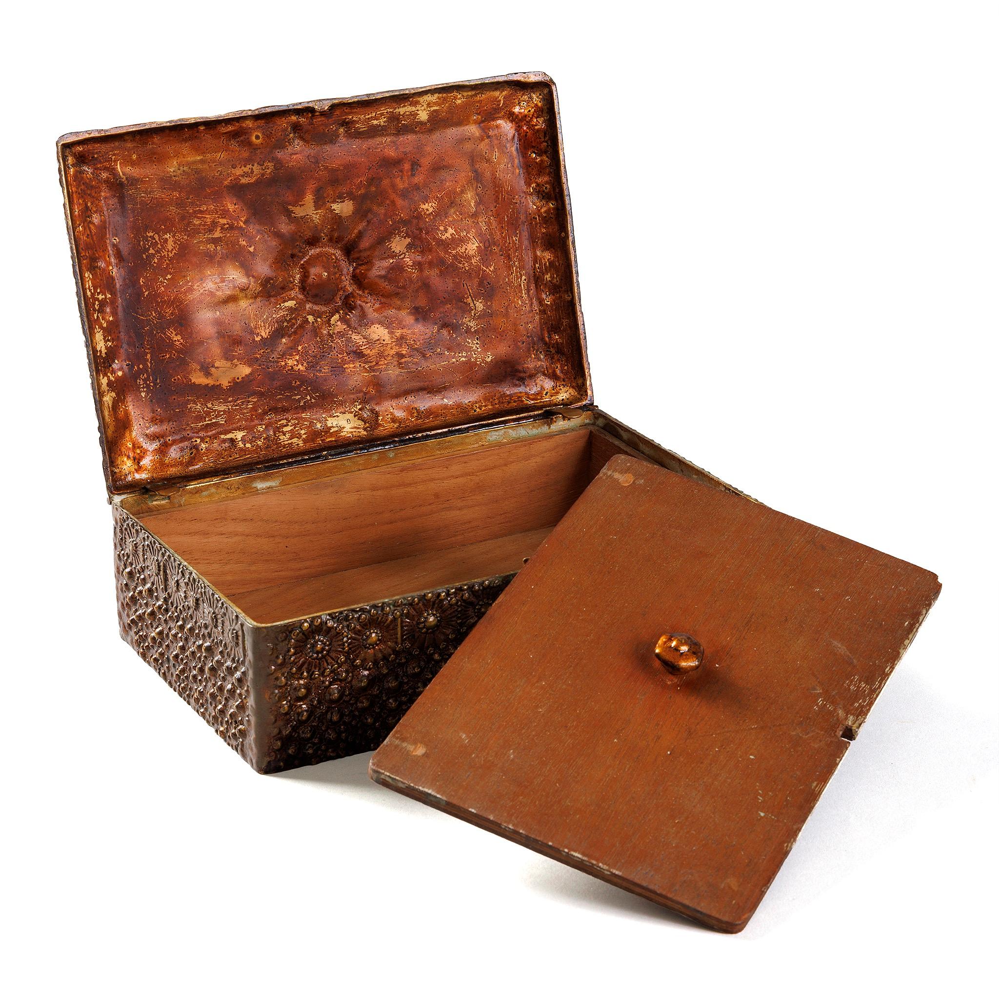 This lacquered bronze “Volcano” humidor by Tiffany Studios New York features a dramatic design of a submarine volcano surrounded by sea urchins, created by Munich artist Ludwig Vierthaler during his time with Tiffany in the late 1890s. After