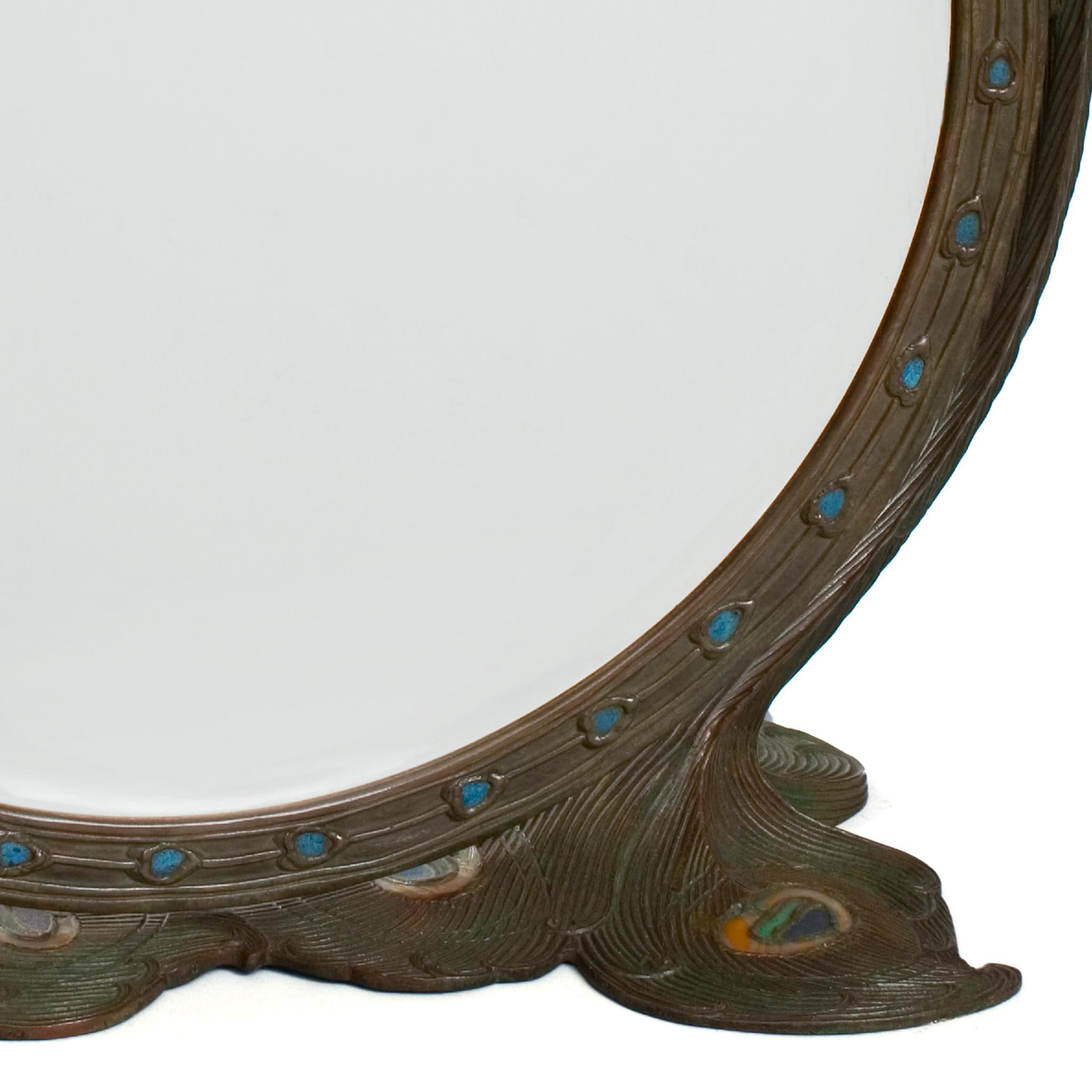 A common theme in the Tiffany Studios New York oeuvre, the peacock motif, as can be seen in this exquisite 