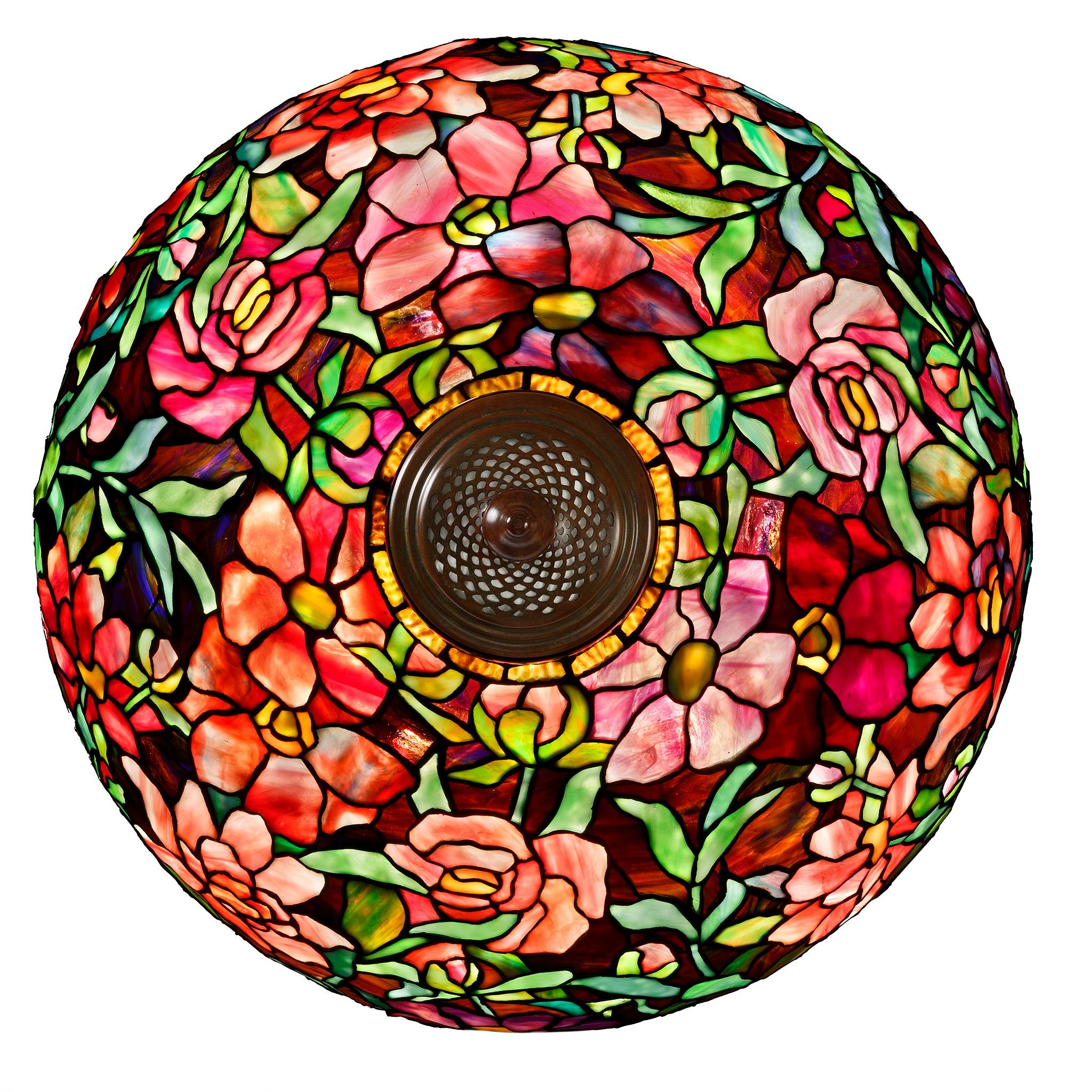 Tiffany’s “Peony” table lamp was a work grounded in naturalism but reaching for the divine. With a shade of resplendent blooms and a mosaic base evoking the hallowed ground of church floors, Tiffany’s peony lamp demonstrates his foundation in both
