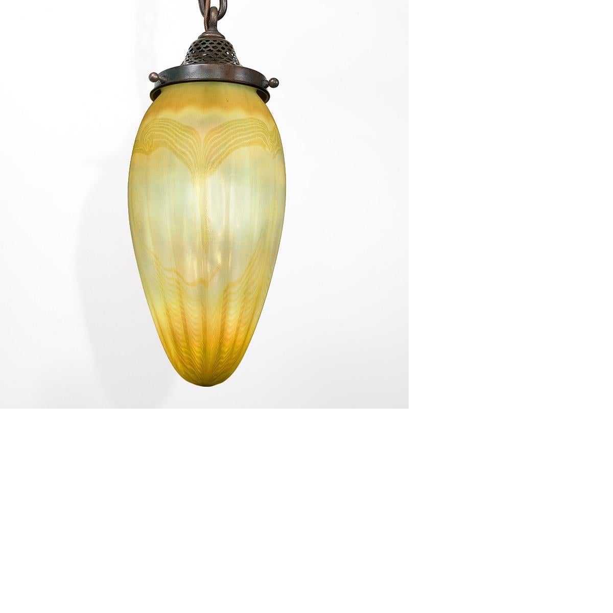 A Tiffany Studios New York golden stalactite chandelier with pulled iridescent gold feather decoration. Circa 1900. A similar fixture is pictured in: Tiffany Lamps and Metalware: An illustrated reference to over 2000 models, by Alastair Duncan,