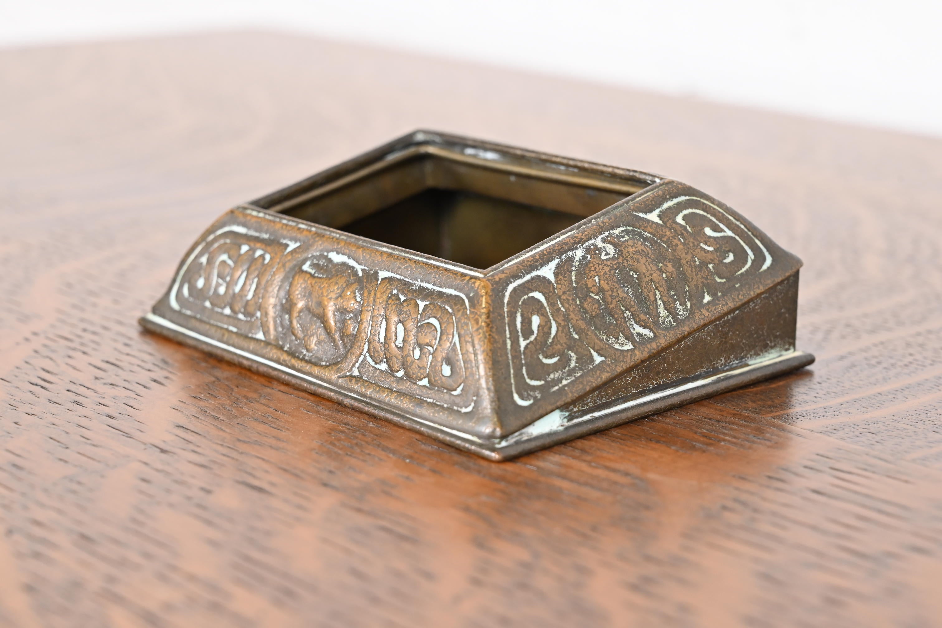 A gorgeous bronze desk calendar holder or picture frame featuring Zodiac designs

By Tiffany Studios

New York, USA, early 20th century

Measures: 4.5
