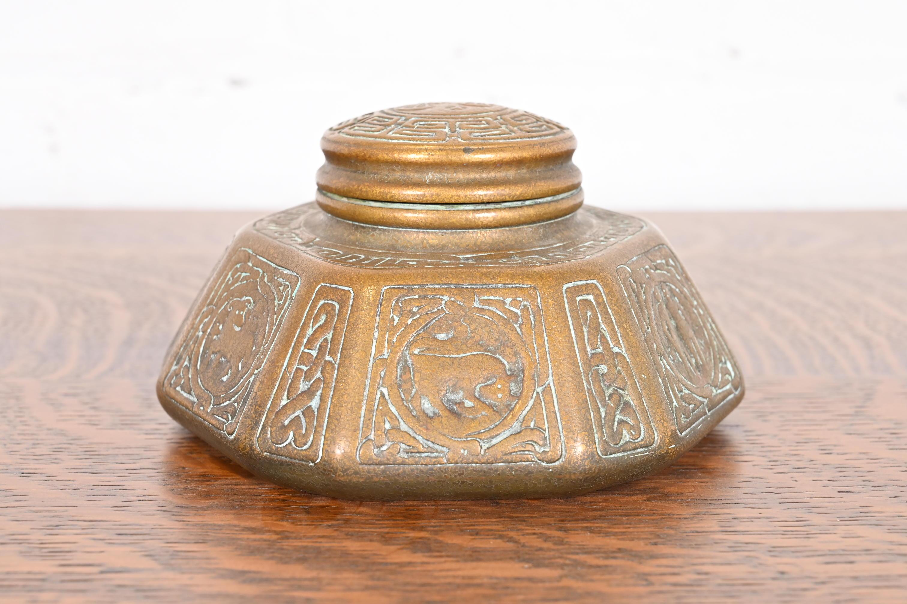 A gorgeous antique bronze doré large inkwell featuring Zodiac designs

By Tiffany Studios

New York, USA, Early 20th Century

Measures: 6.5