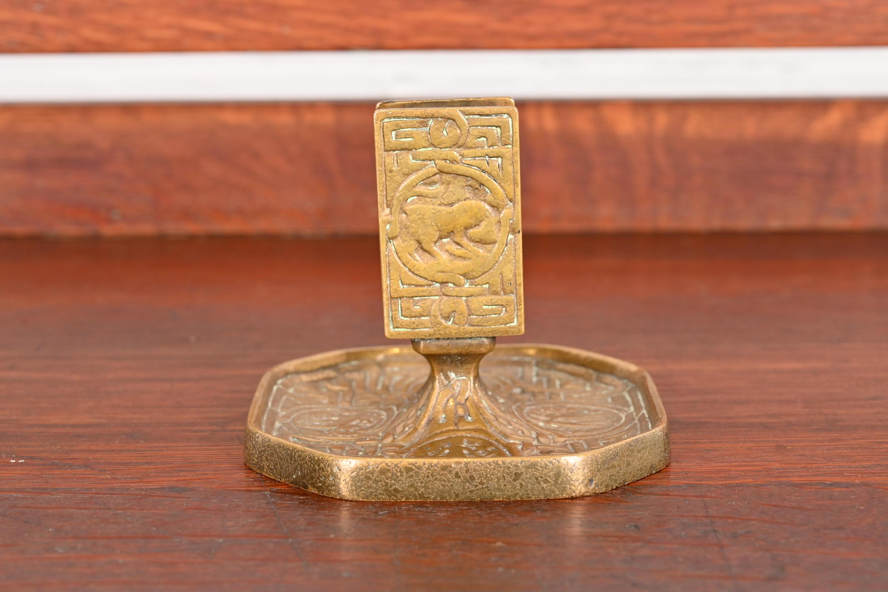 A gorgeous antique gilt bronze match box holder featuring symbols of the Zodiac

By Tiffany Studios (signed to the underside)

New York, USA, Early 20th Century

Measures: 4.5