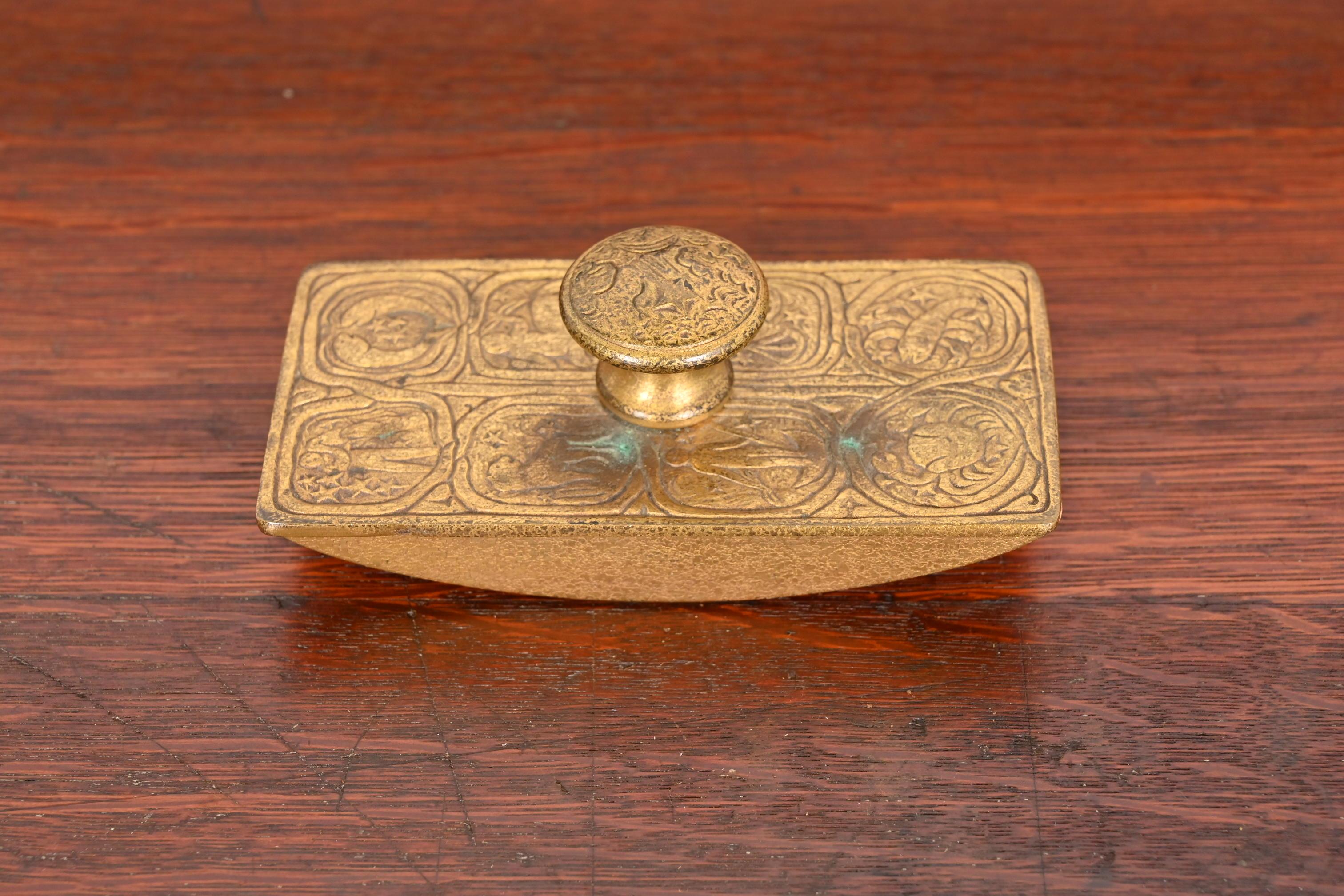 A gorgeous Art Deco period bronze rocker ink blotter featuring Zodiac designs

By Tiffany Studios

New York, USA, Early 20th Century

Measures: 5.63