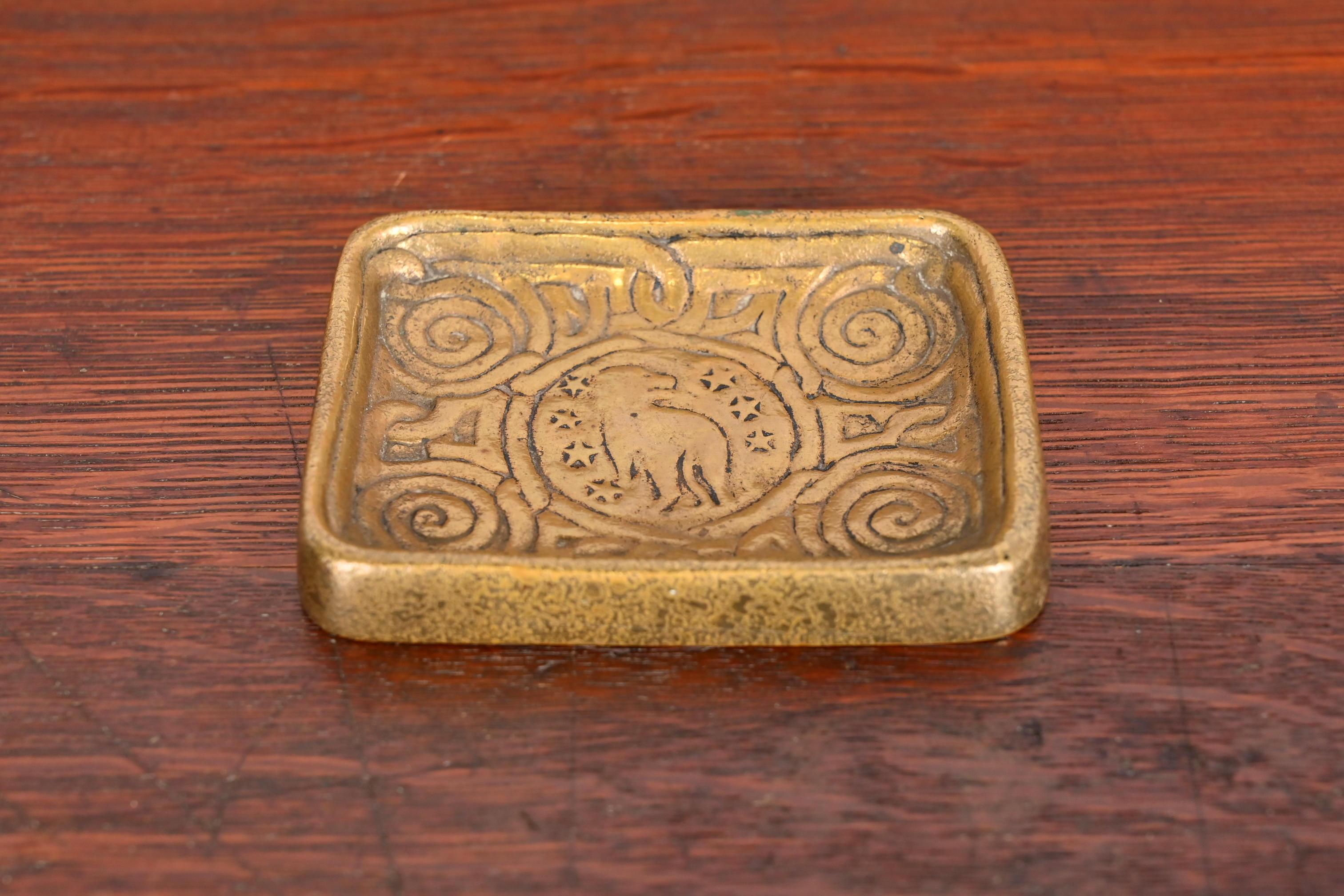 A gorgeous antique gilt bronze stamp tray featuring Zodiac designs

By Tiffany Studios (signed to the underside)

New York, USA, Early 20th Century

Measures: 4