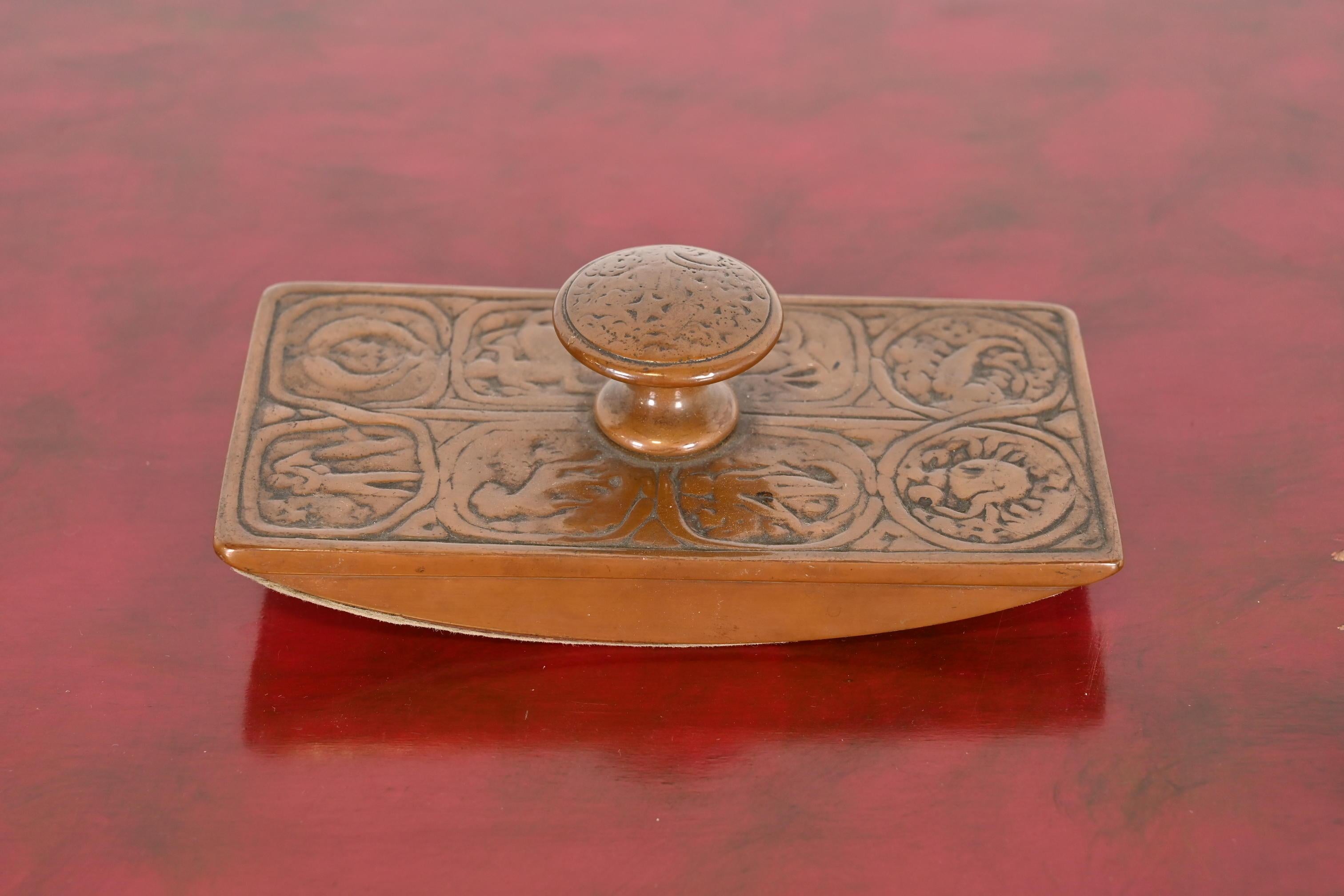 A beautiful antique bronze rocker ink blotter featuring Zodiac designs

By Tiffany Studios (signed on the side)

New York, USA, Early 20th Century

Measures: 6